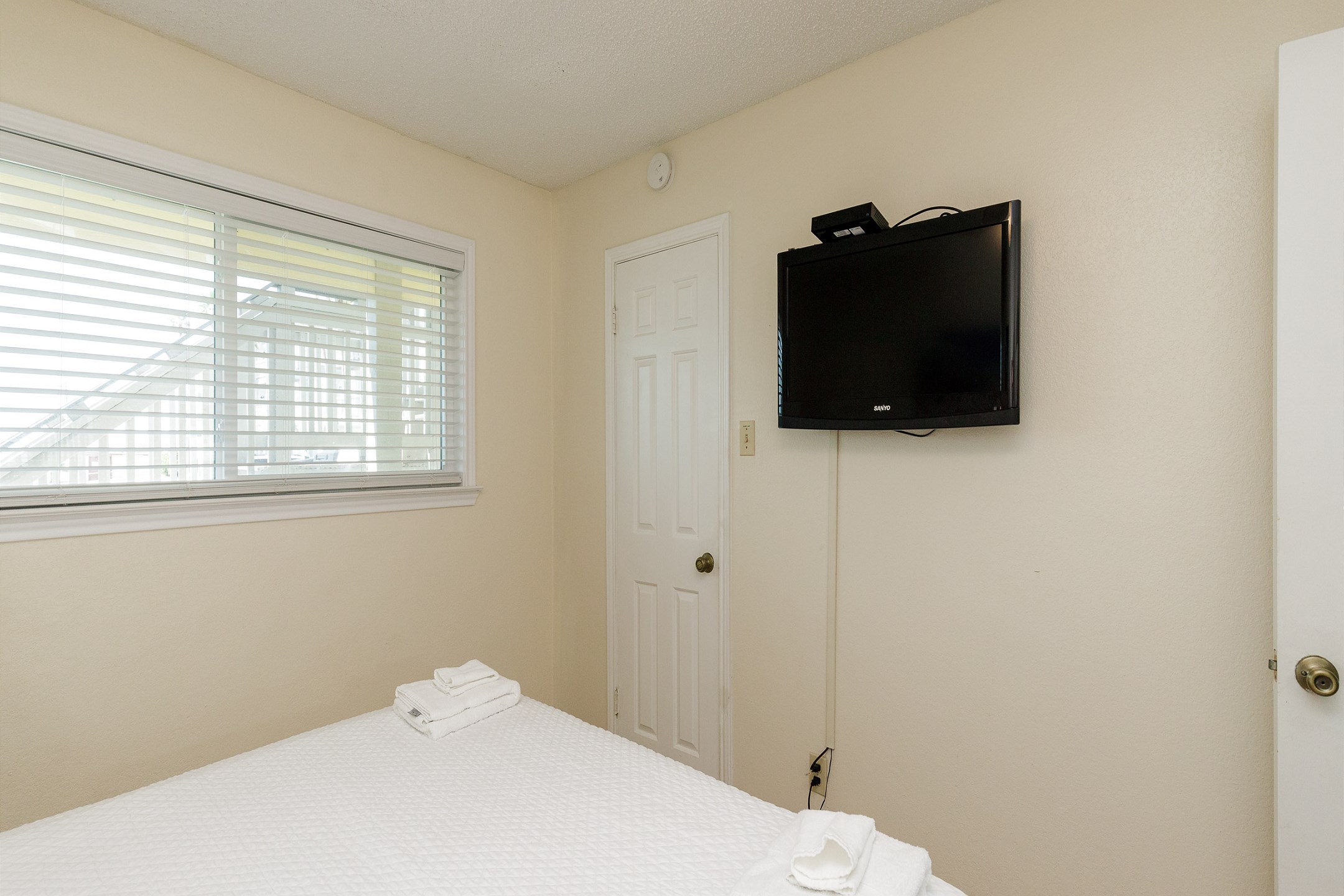 Master bedroom with king size bed and flat screen TV