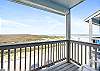 Enjoy the Texas breeze on this private balcony with a Beach view 