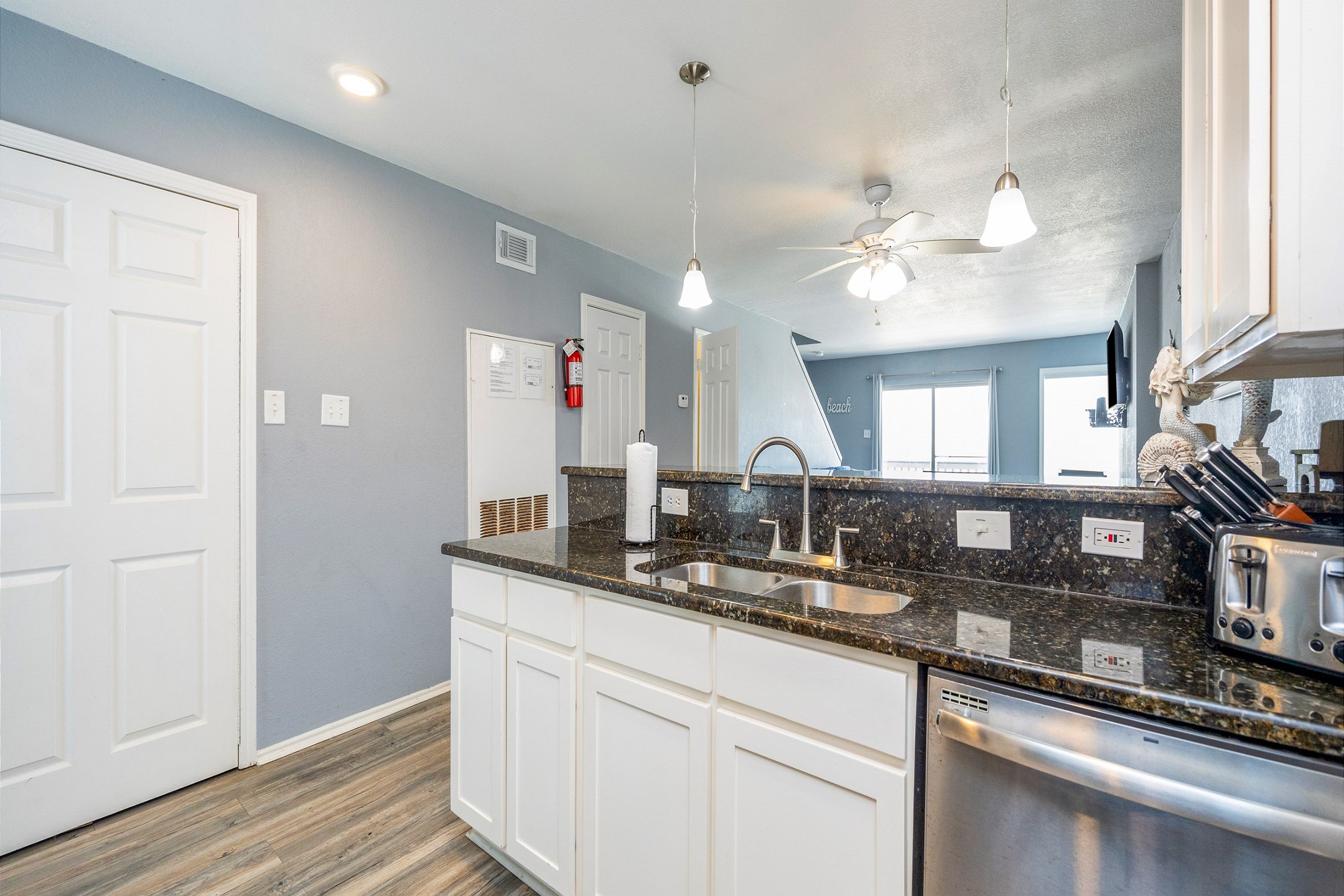 Stylish kitchen equipped with granite countertops and abundant space for crafting delicious meals