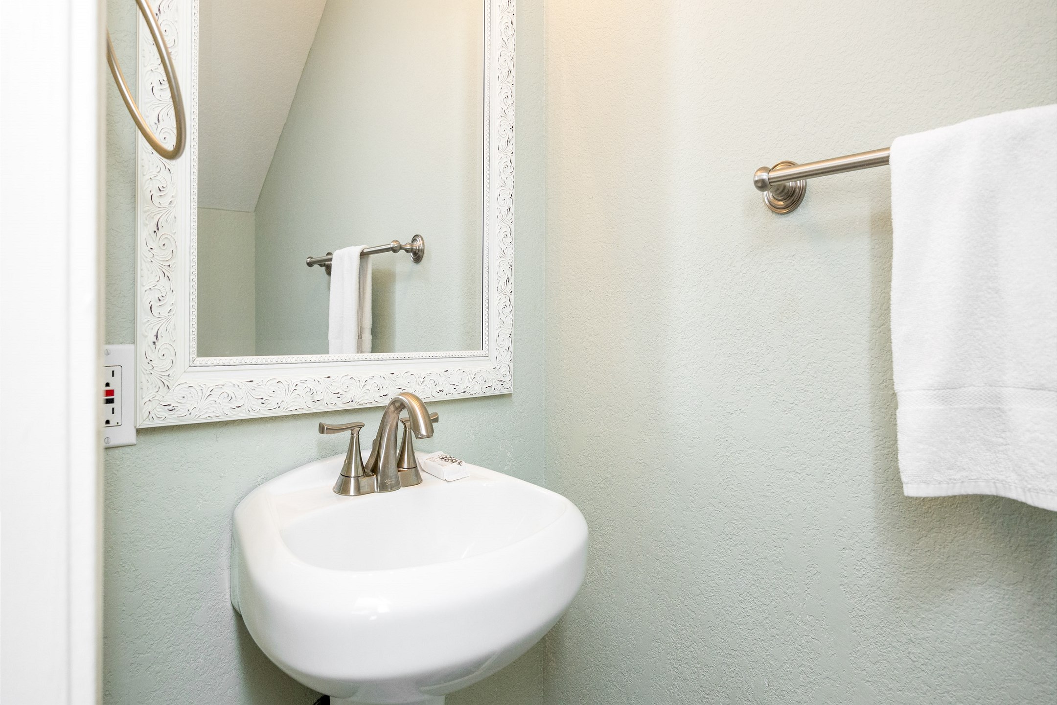 Half bathroom on the first floor with toilet and sink 