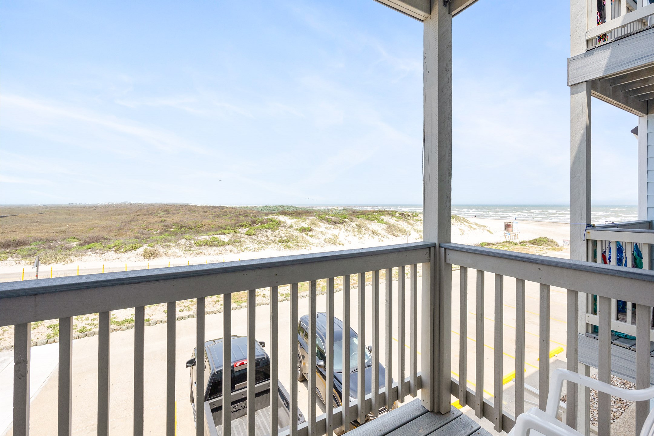 Private balcony off of the living area with beach view