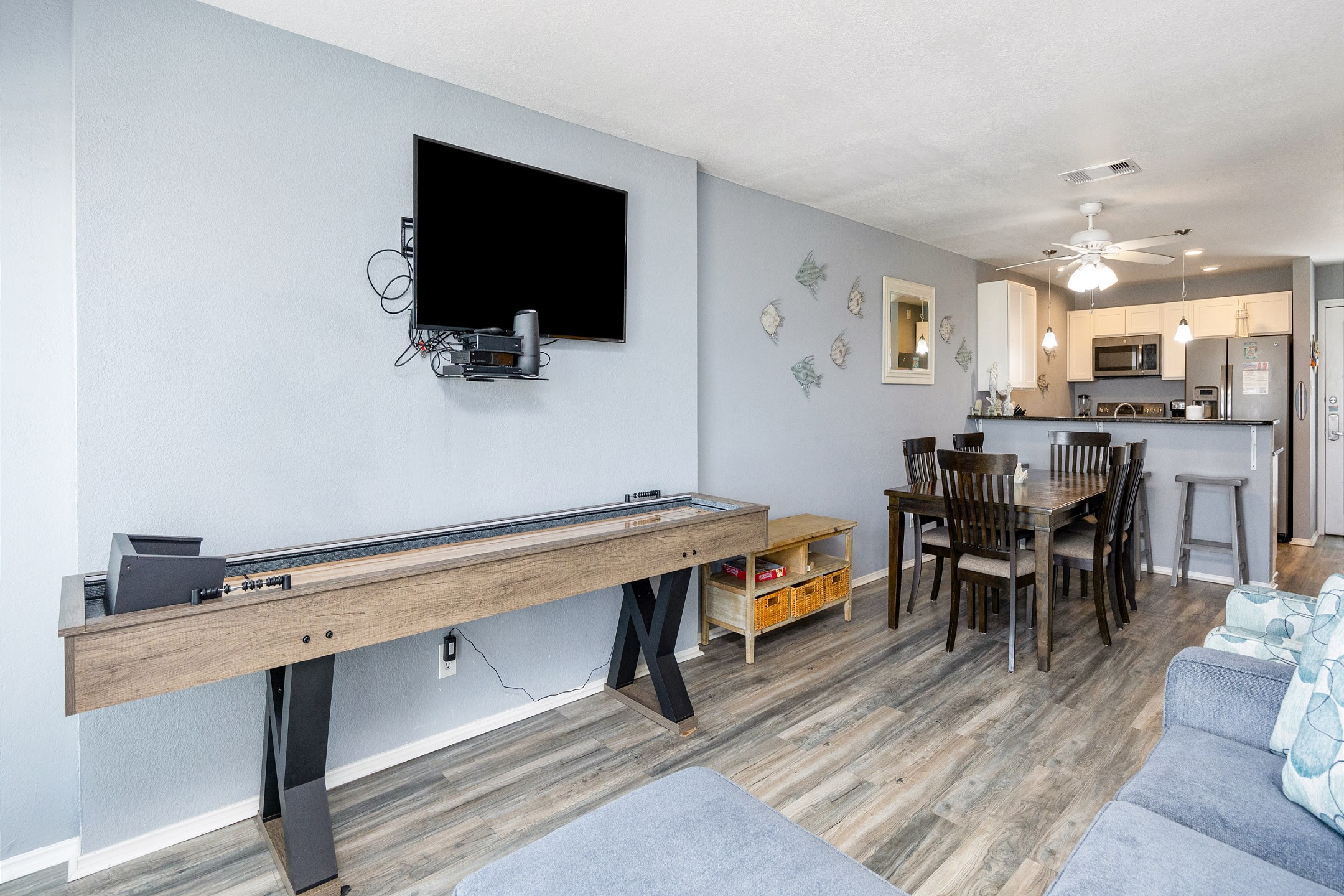 Cozy living area with shuffle board and flat screen TV 