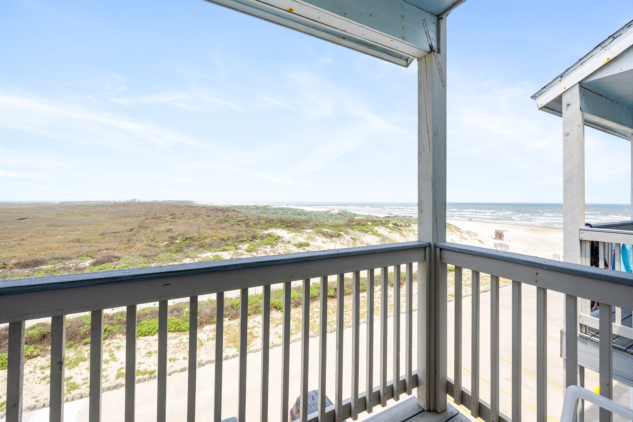 Enjoy the Texas breeze on this private balcony with a beach view 