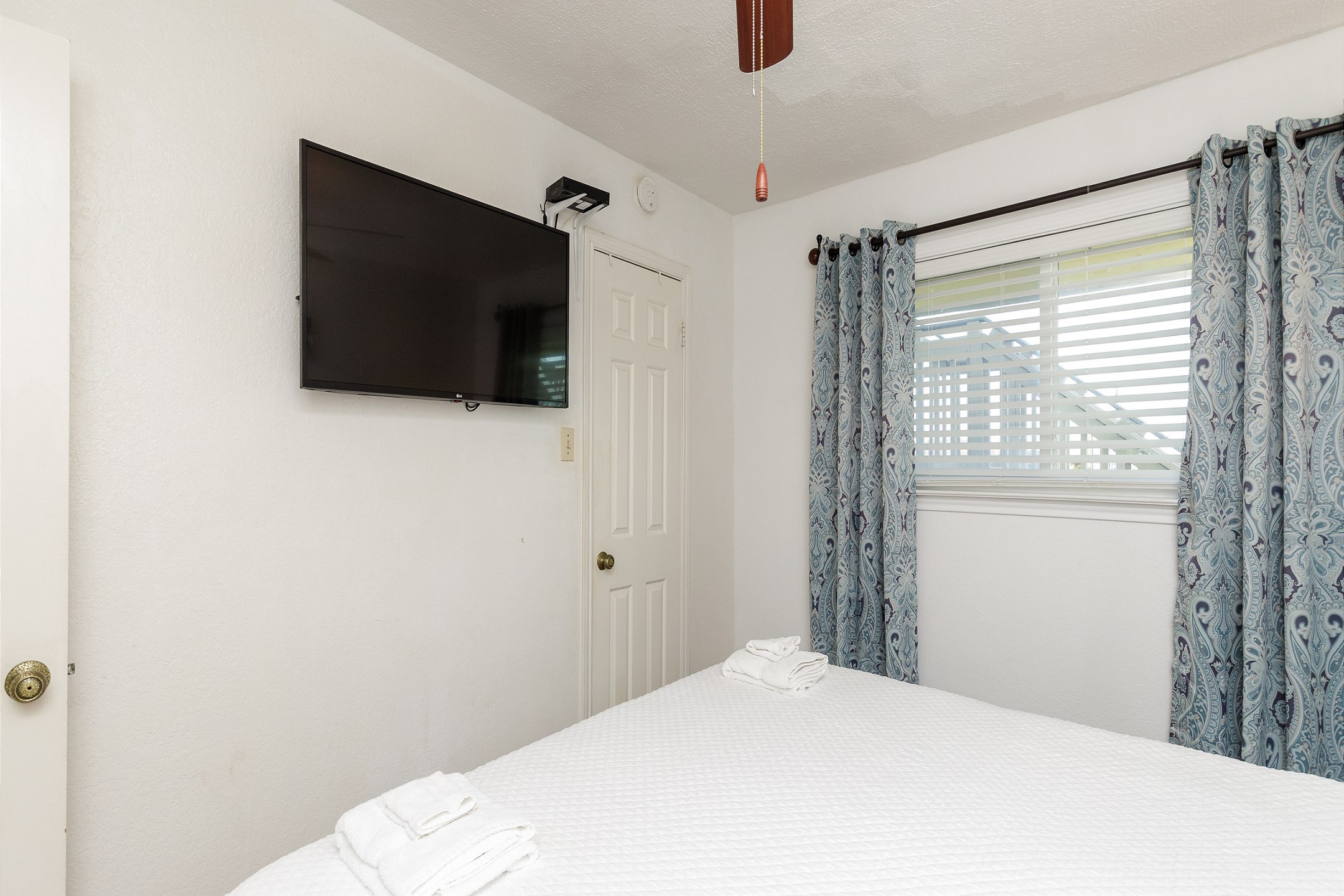 Master bedroom with king size bed and flat screen TV