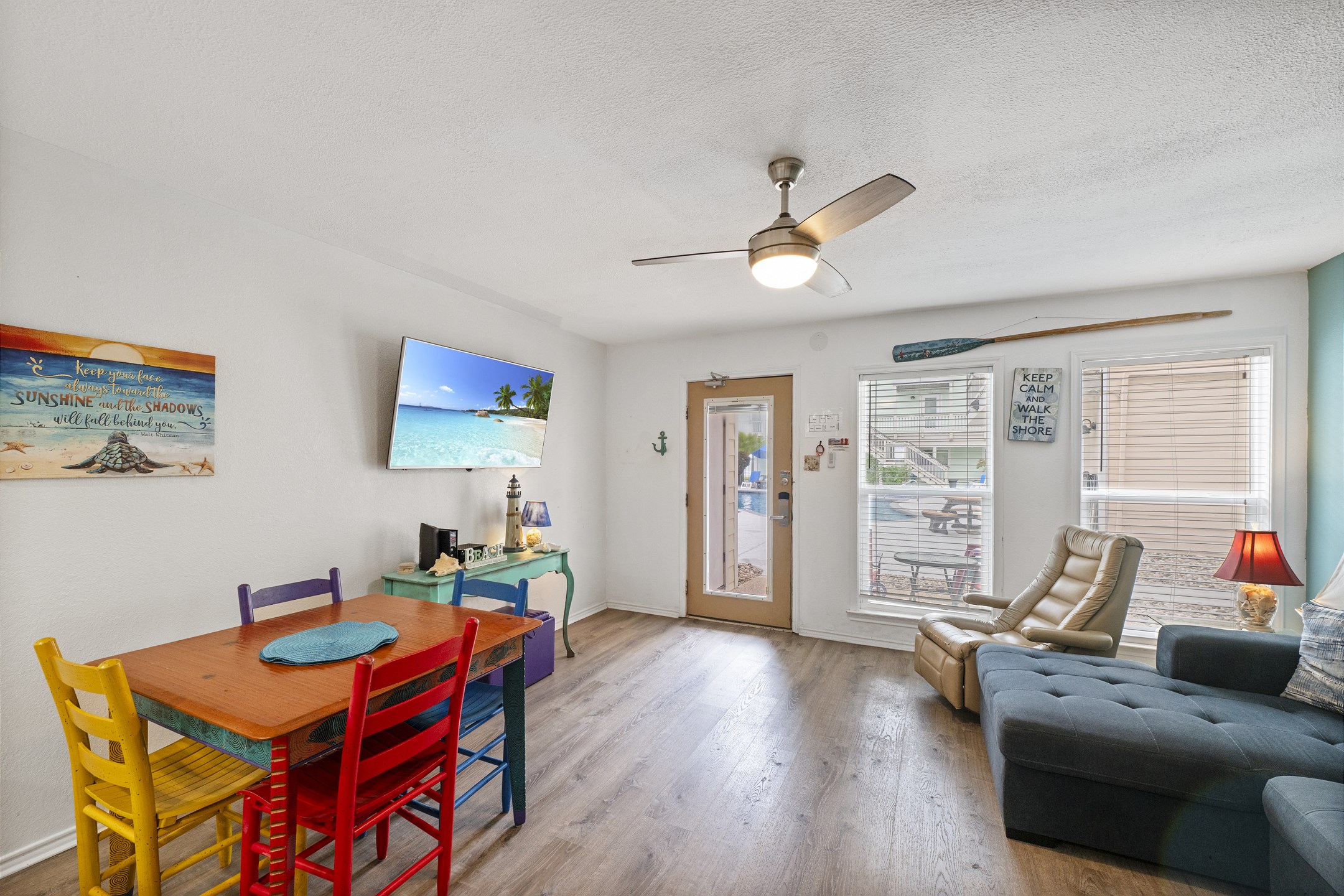 Bright and beachy living space with a flat-screen TV for laid-back vibes