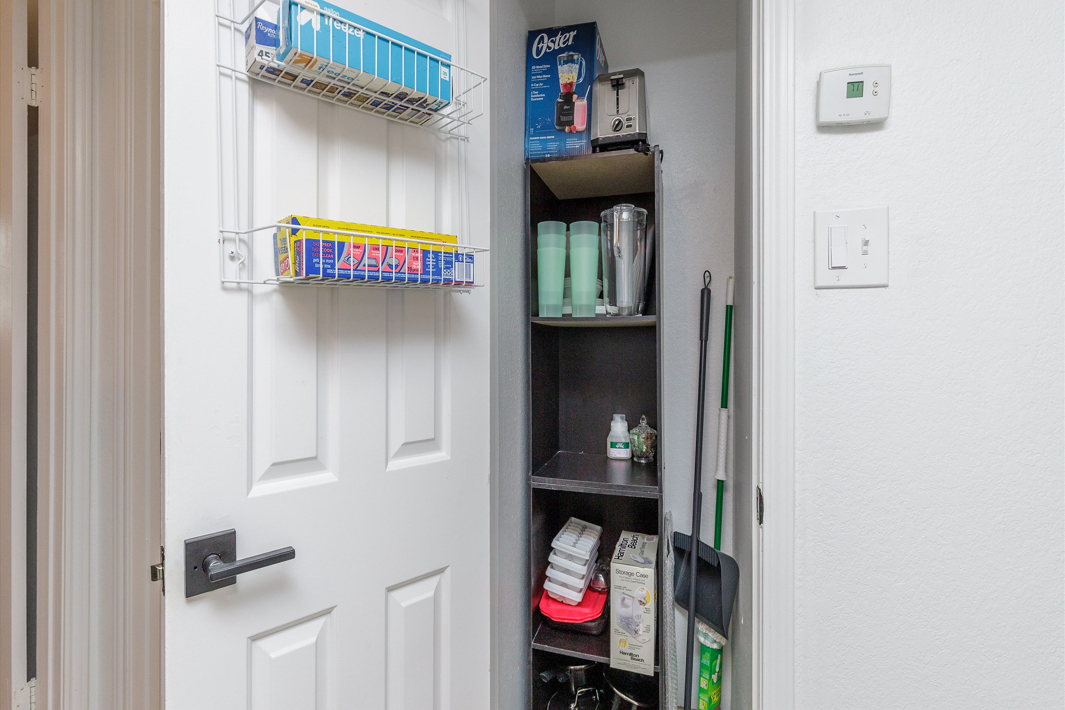 Compact closet across kitchen for convenient storage