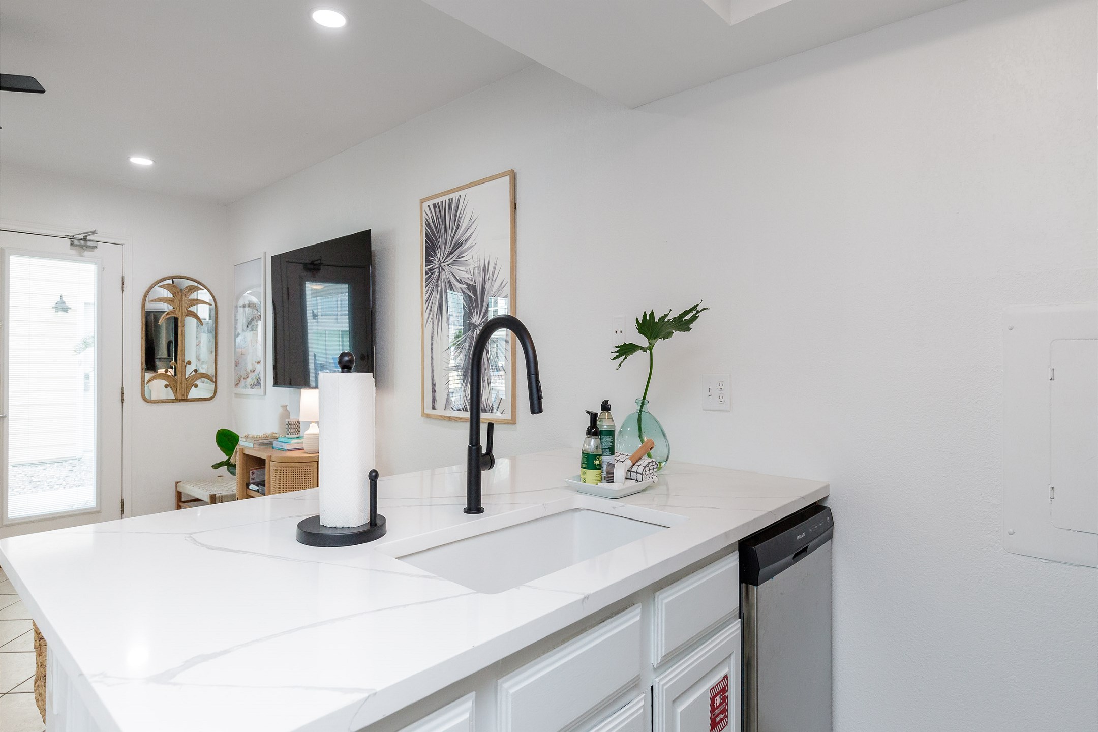 Fully equipped kitchen area with new stainless steel appliances and upgraded counters and cabinets 