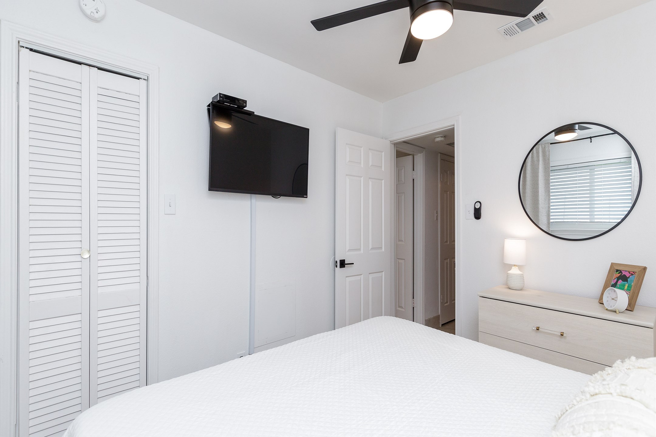 Master bedroom with king size bed and flat screen TV