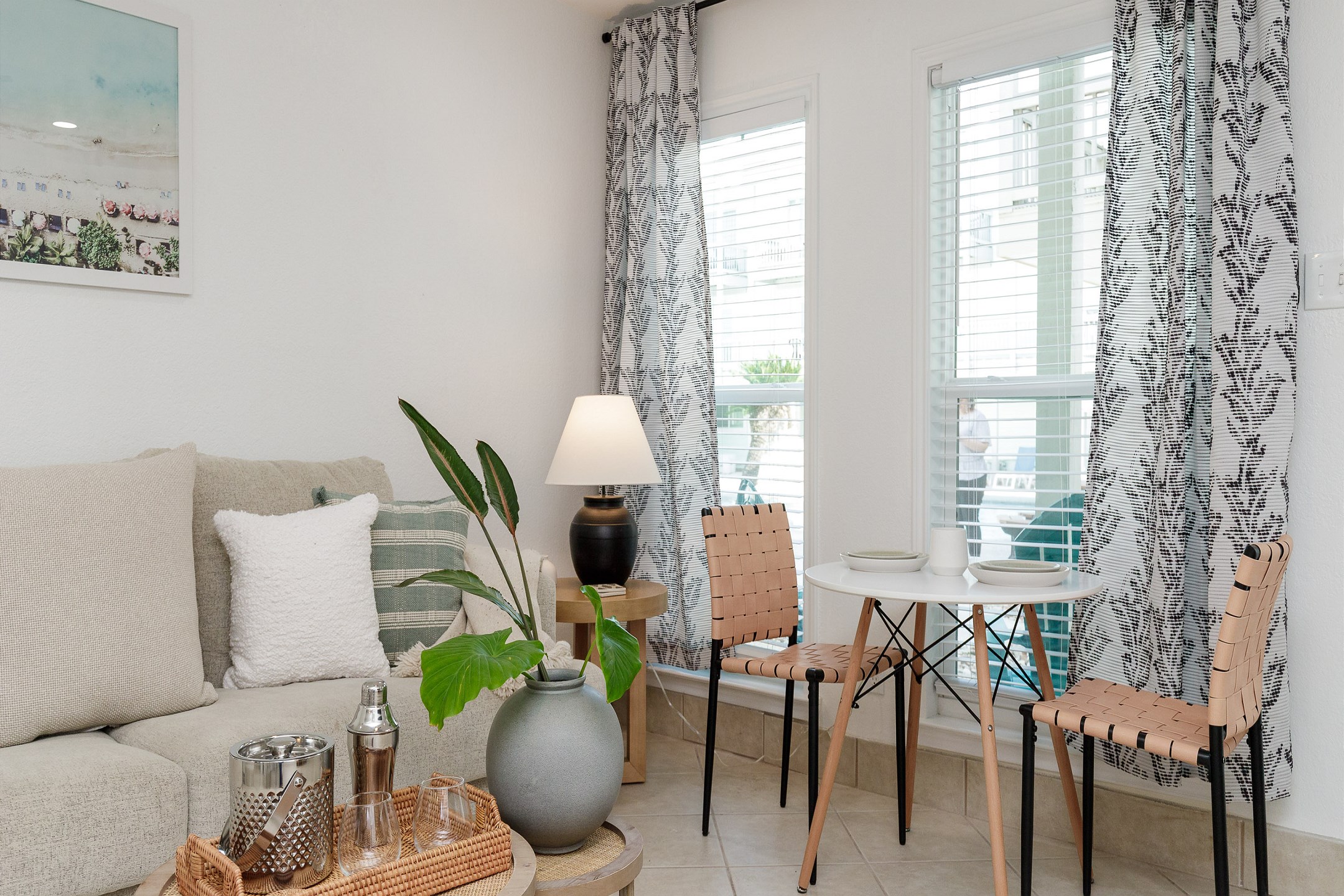 Lovely seating area for two with a view of the pool out the large windows