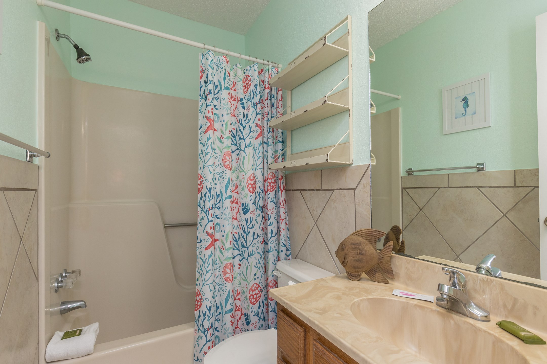 Guest bathroom on the second floor with tub and shower combo
