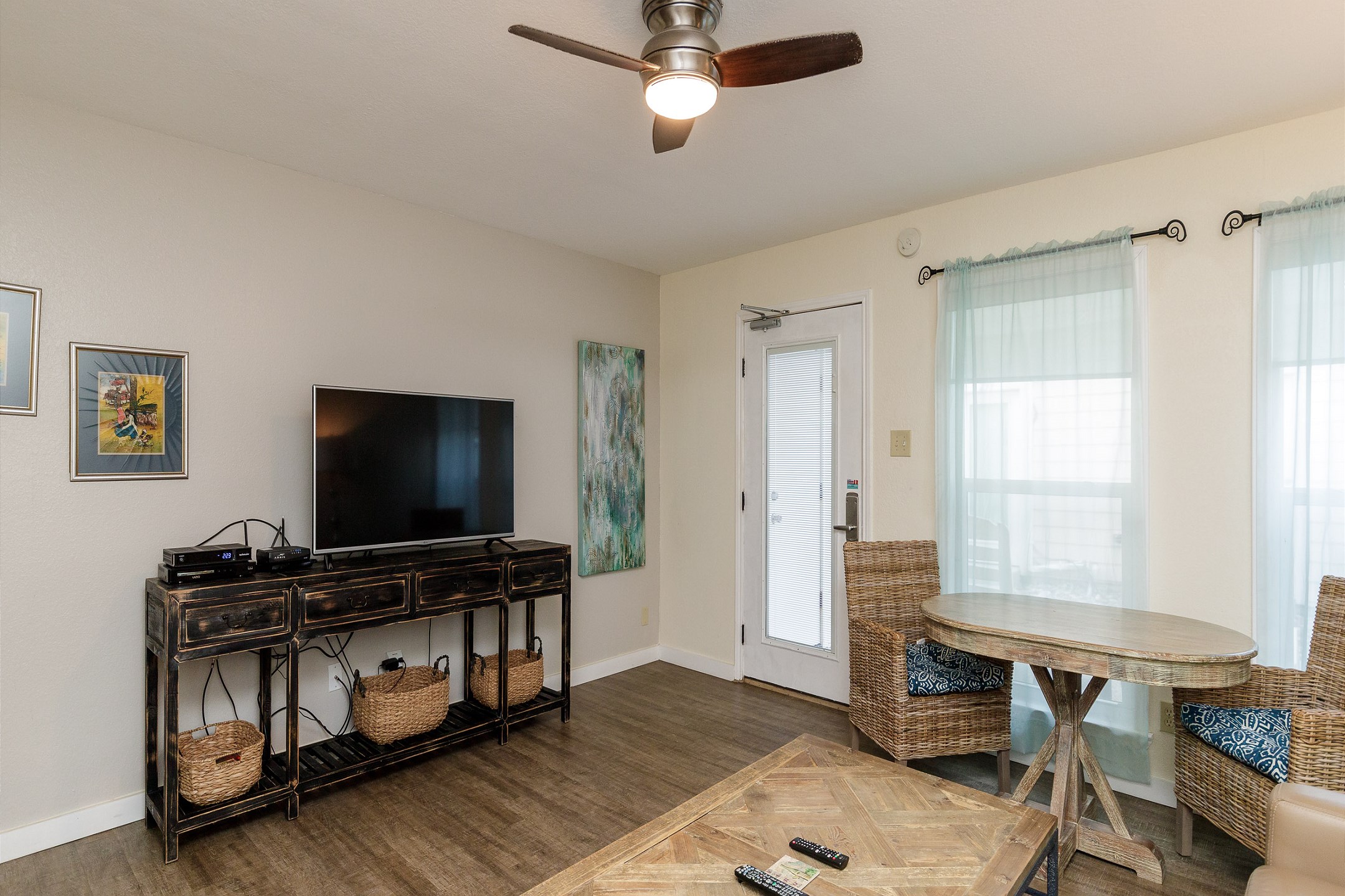 Modern entertainment haven boasting a state-of-the-art flat-screen TV, streaming services, and comfortable lounging options for movie nights