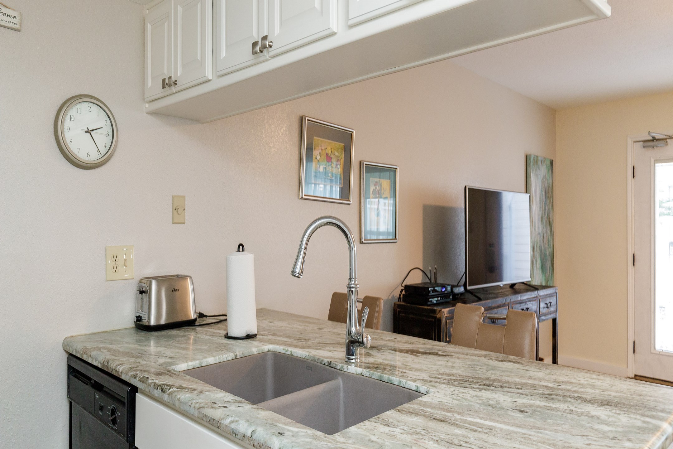 Kitchen area with beautiful counter tops and plenty of storage 