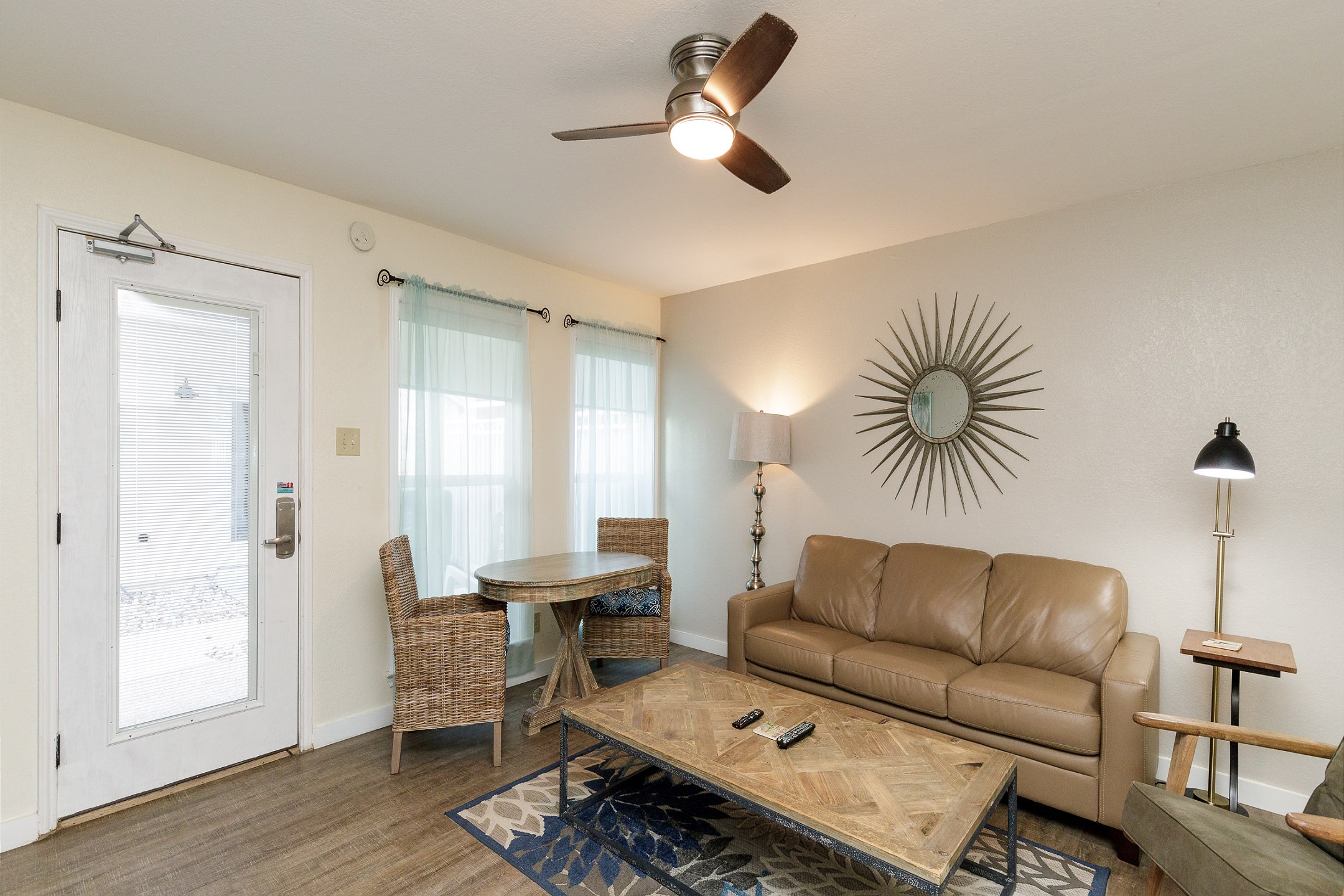 Open-concept living area featuring sleek, modern furnishings