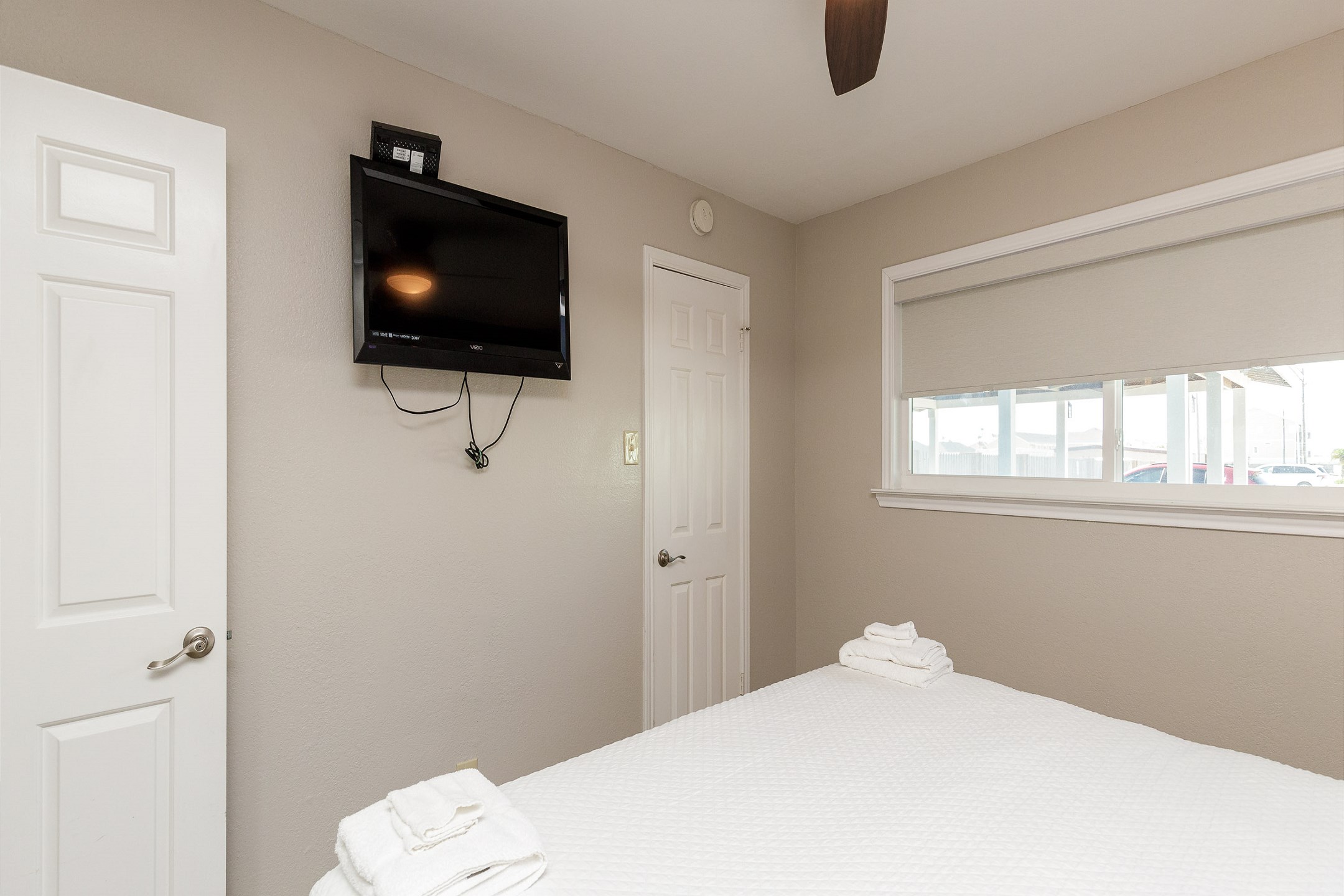 Master bedroom with king size bed and flat screen TV