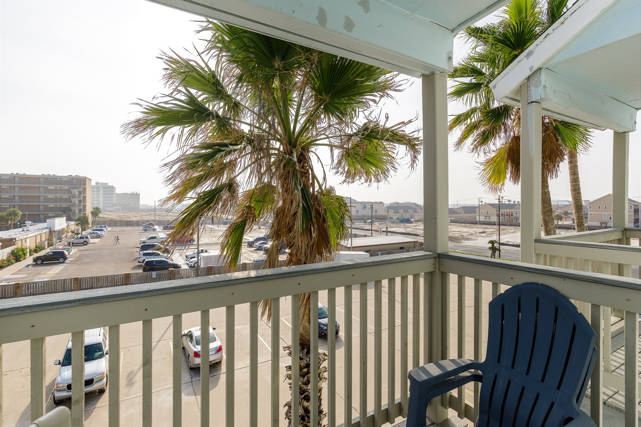 Private balcony off the second bedroom with parking lot views 