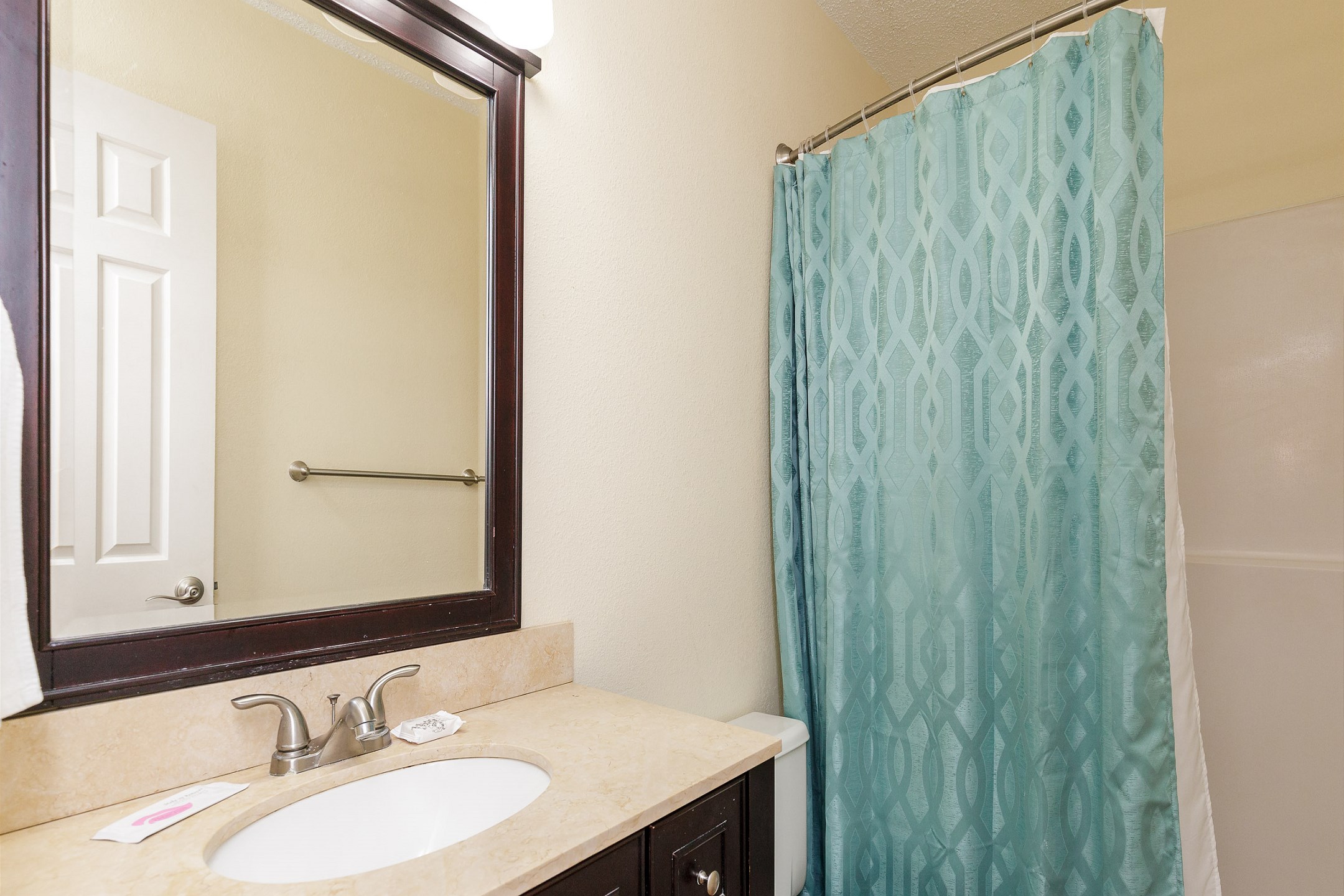 Guest bathroom with tub and shower 