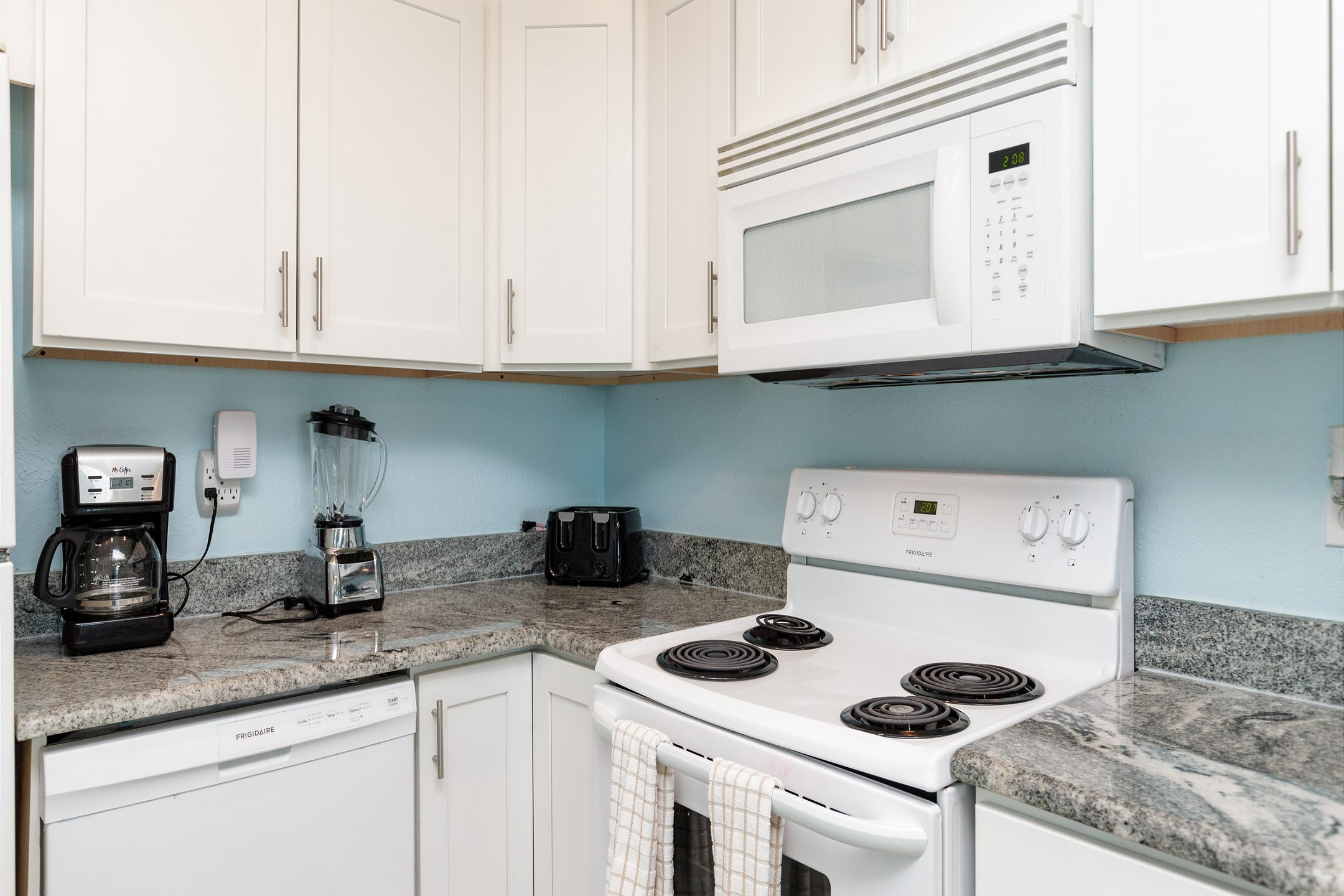 Fully equipped kitchen with ample storage and counter space 