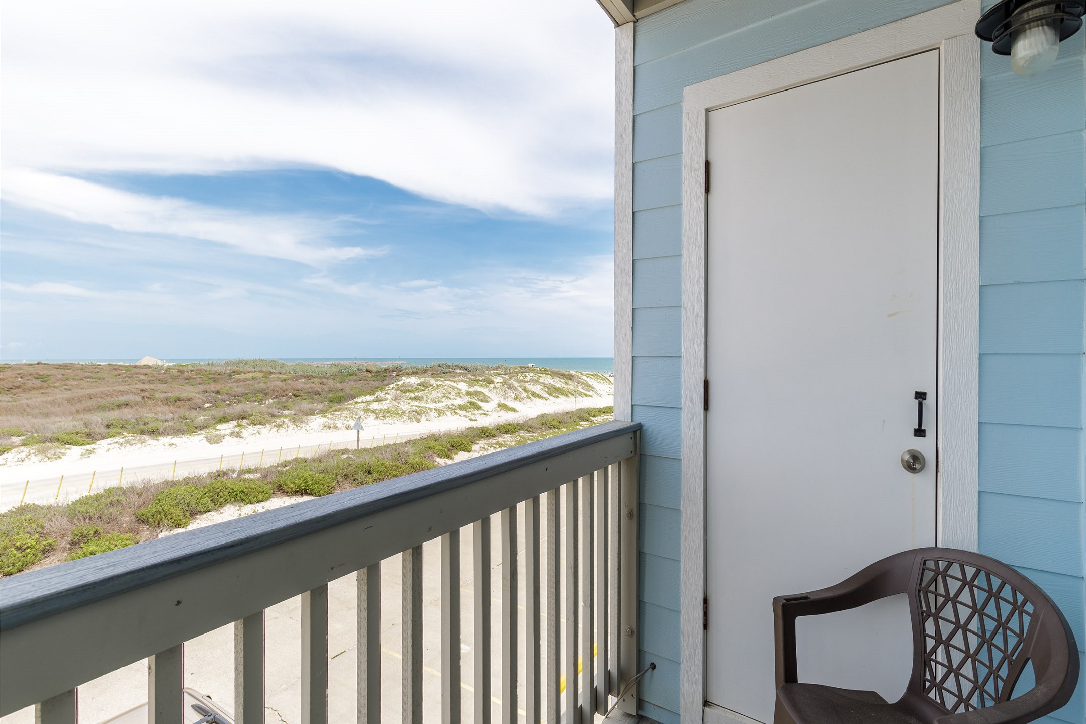 Private balcony off the living area with seating for two 