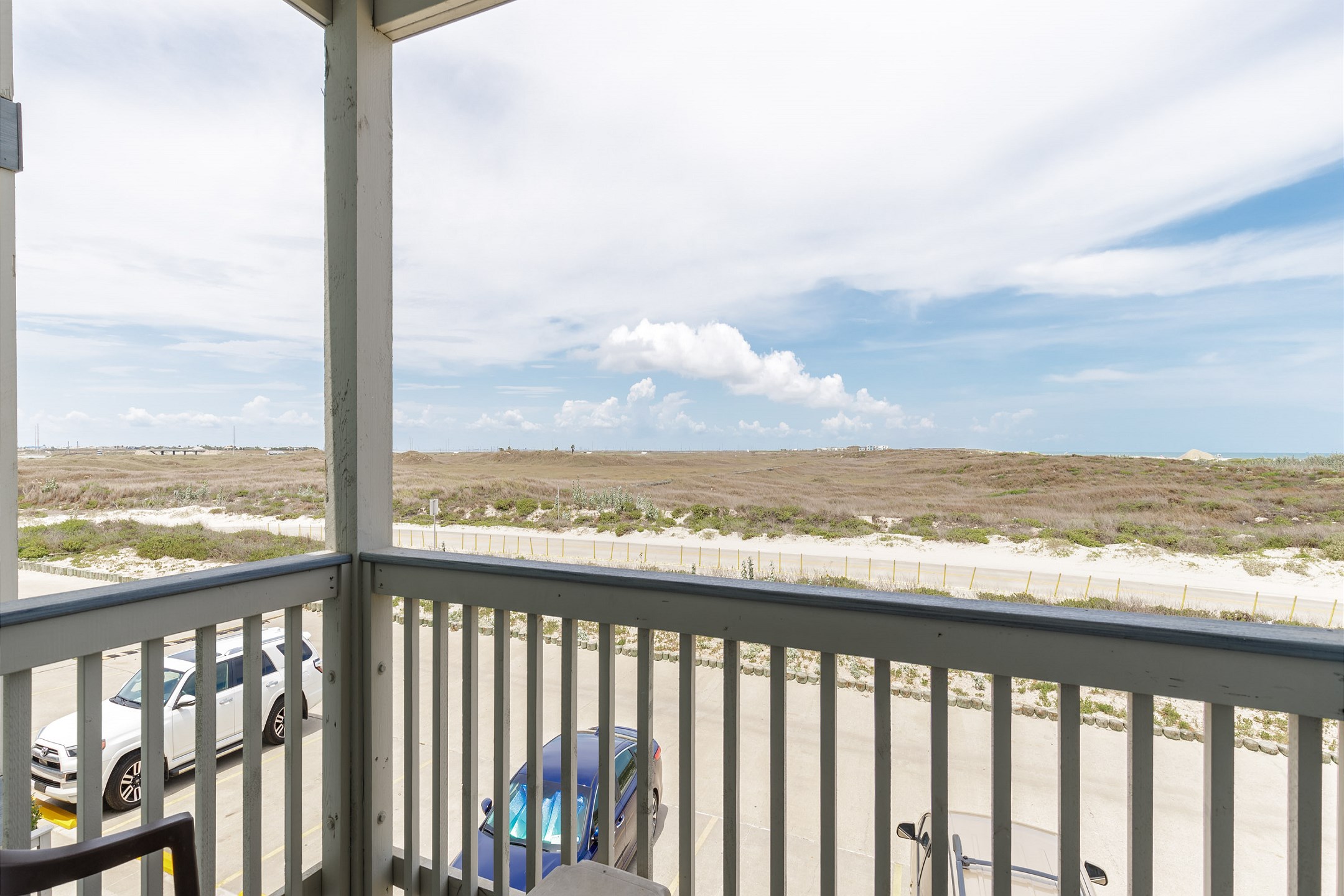 Private balcony off the living area with seating for two 