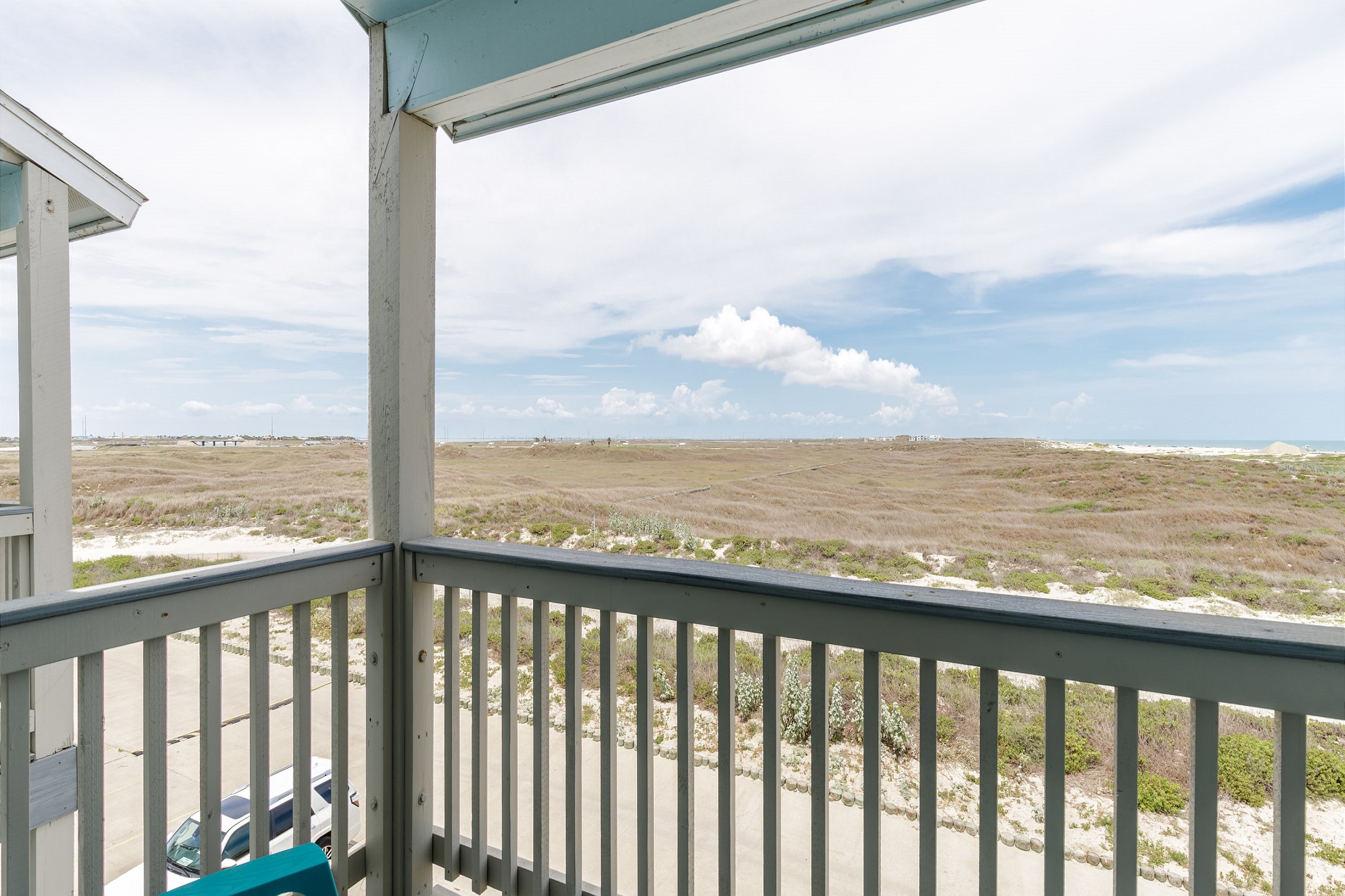 Private balcony off the master bedroom with seating for two 