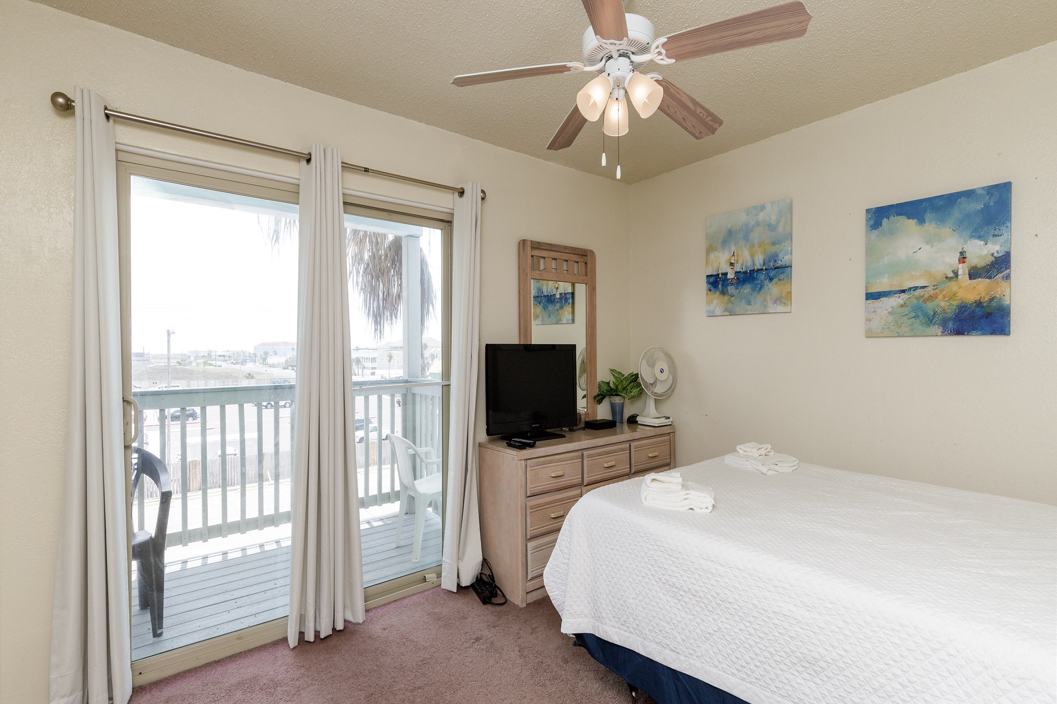 Second bedroom on second floor with queen size bed and flat screen TV
