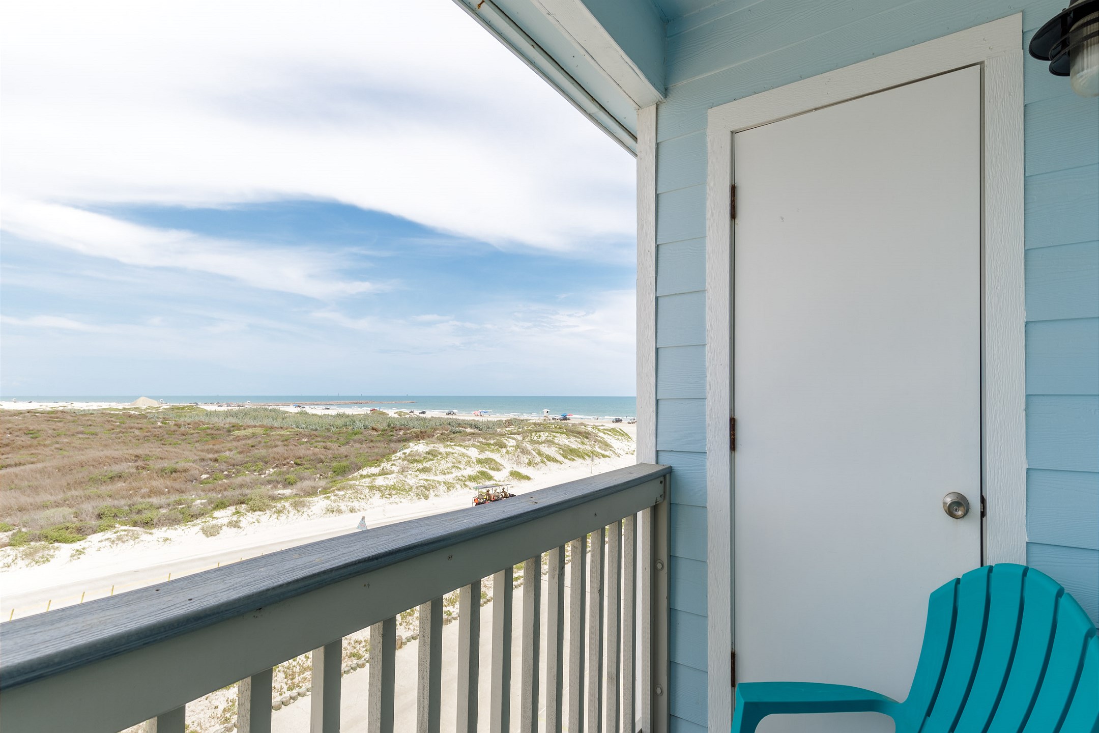 Private balcony off the master bedroom with seating for two 