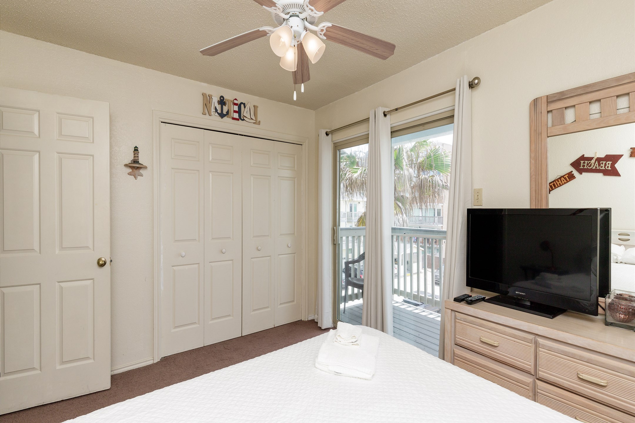 Second bedroom on second floor with queen size bed and flat screen TV
