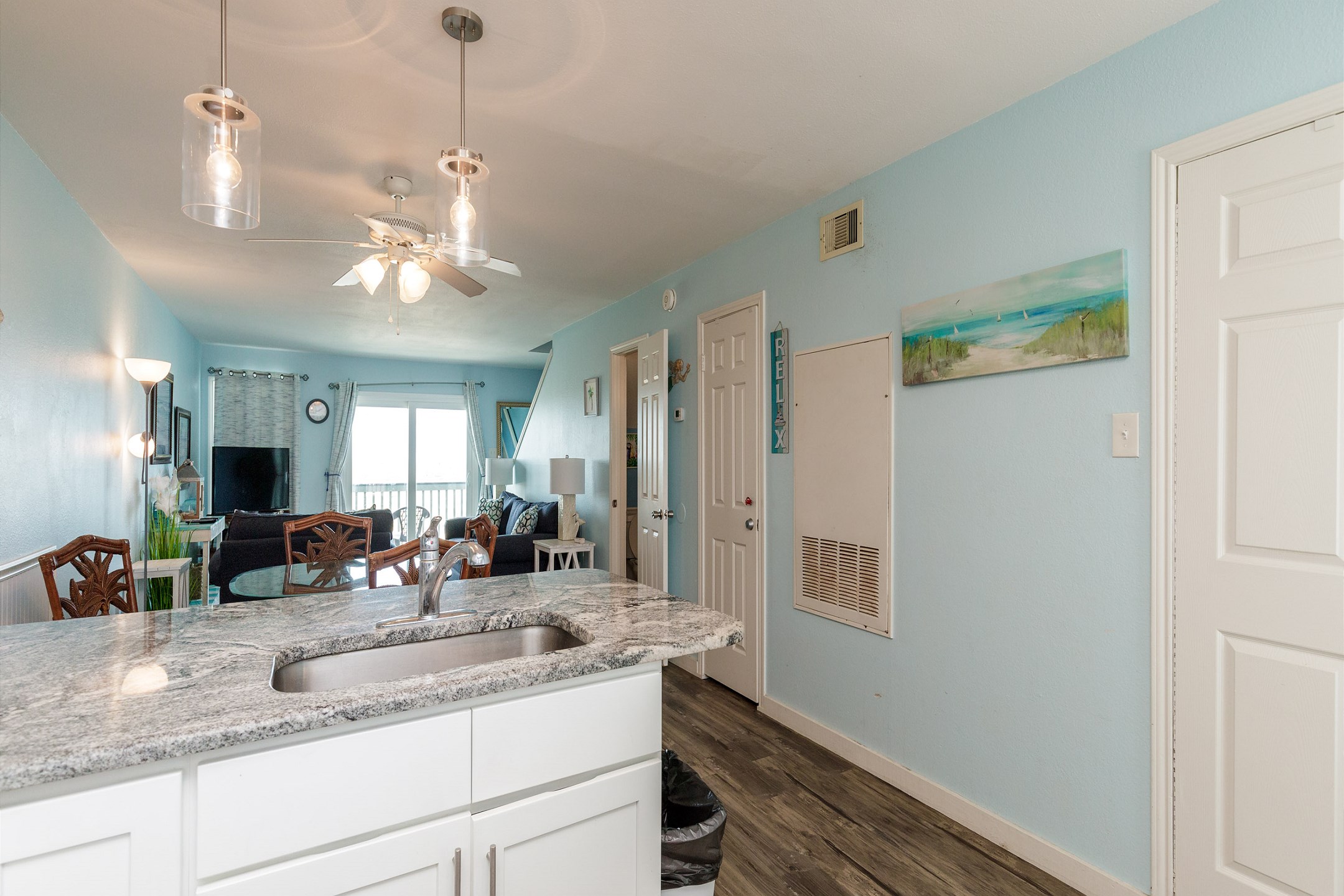 Open concept kitchen with natural light shining in 