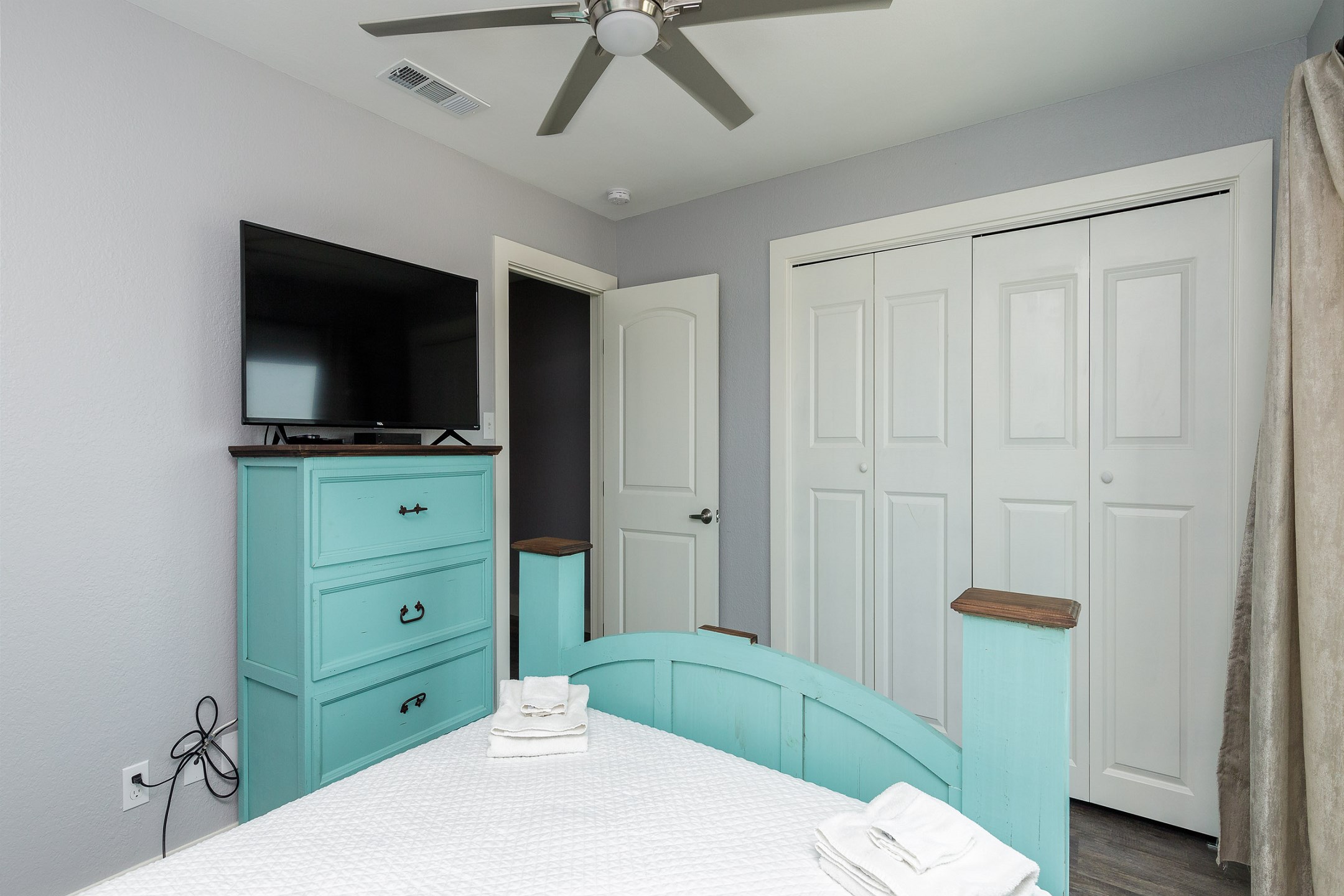 Second bedroom on the second floor with queen size bed, private balcony and flat screen TV