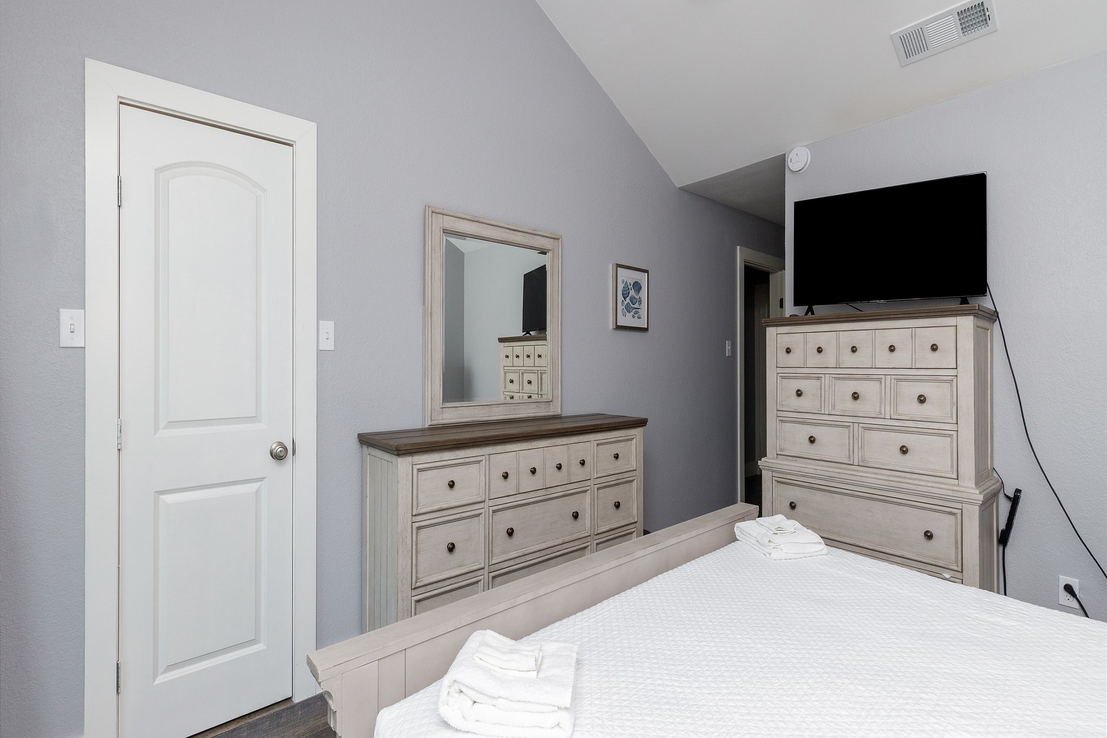 Master bedroom on the second floor with king size bed, private bathroom, balcony and flat screen TV