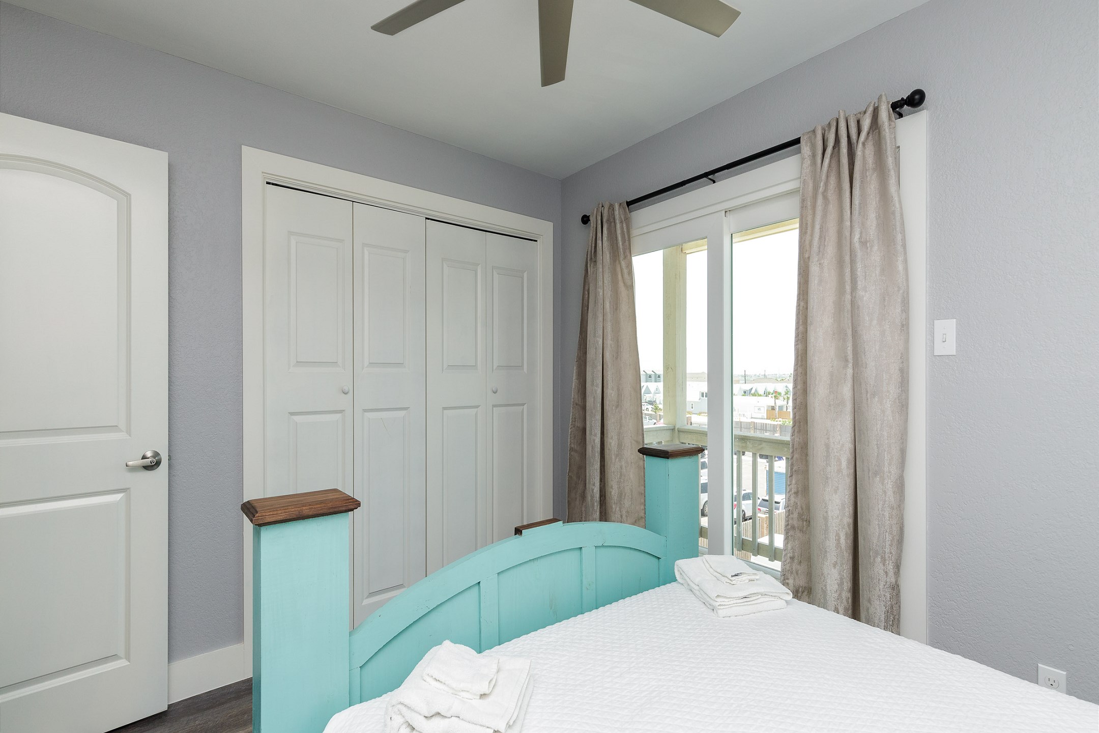 Second bedroom on the second floor with queen size bed, private balcony and flat screen TV