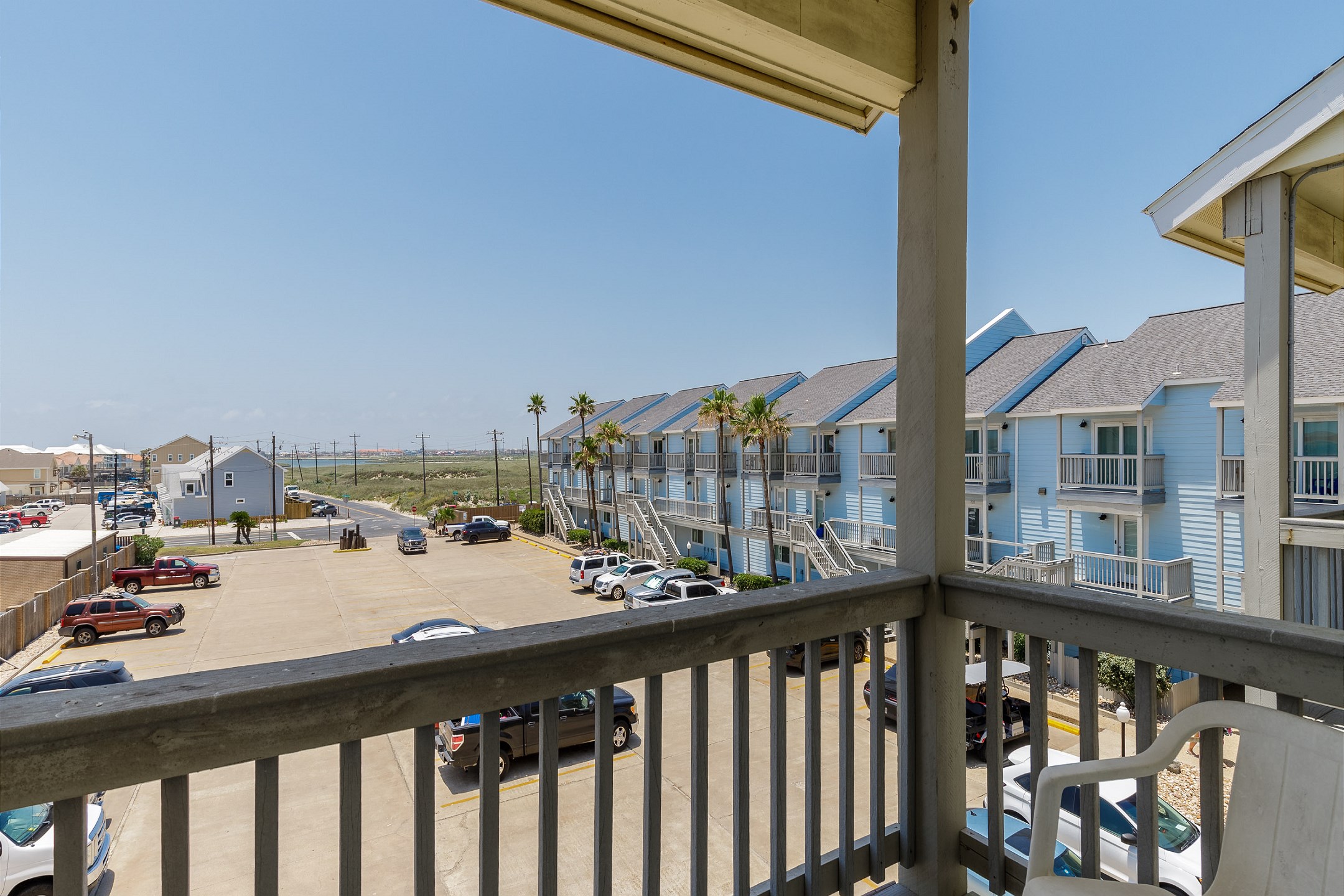 Private balcony off the second bedroom with parking lot views