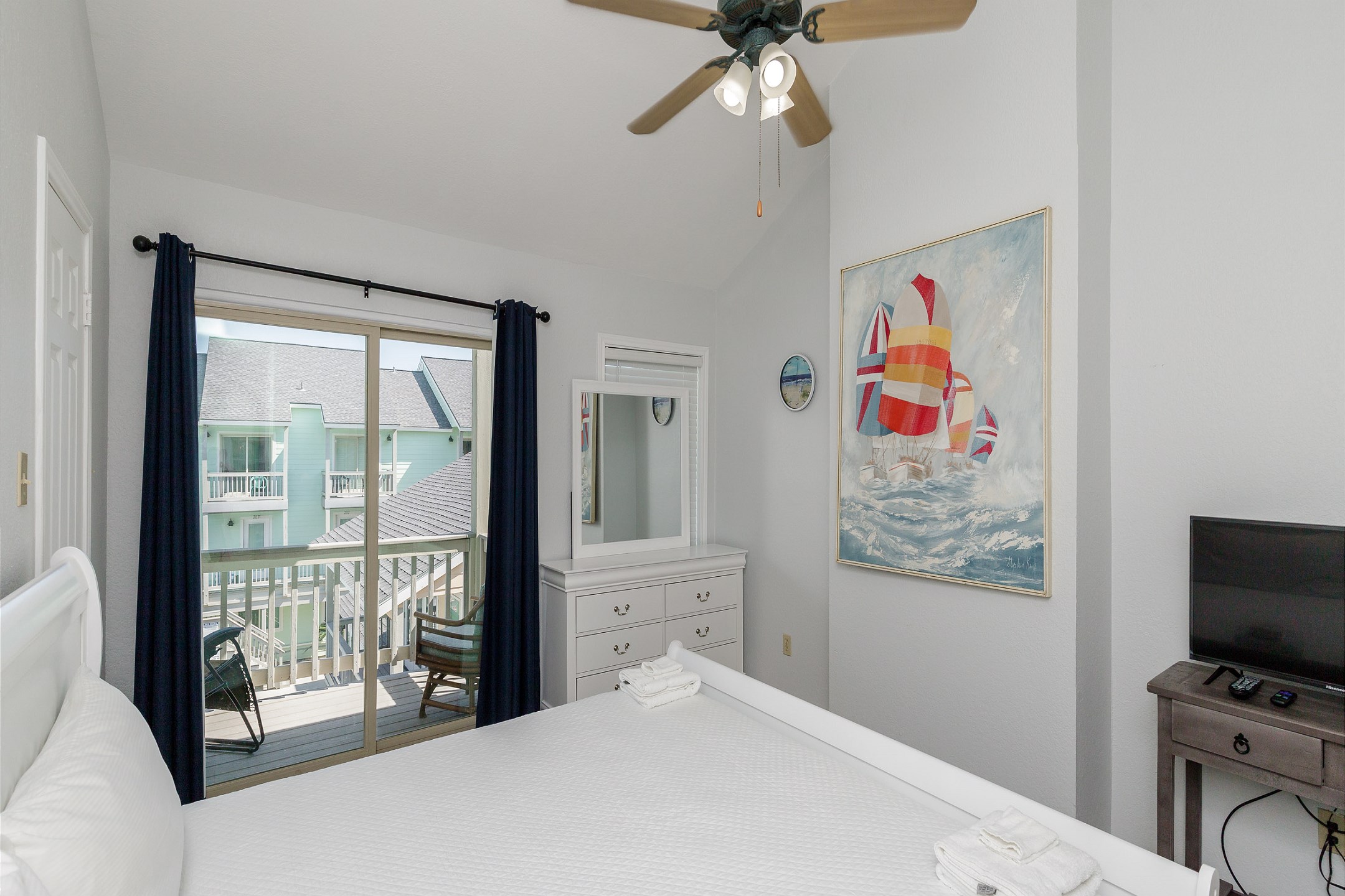 Master bedroom on the second floor with king size bed, private bathroom, balcony and flat screen TV