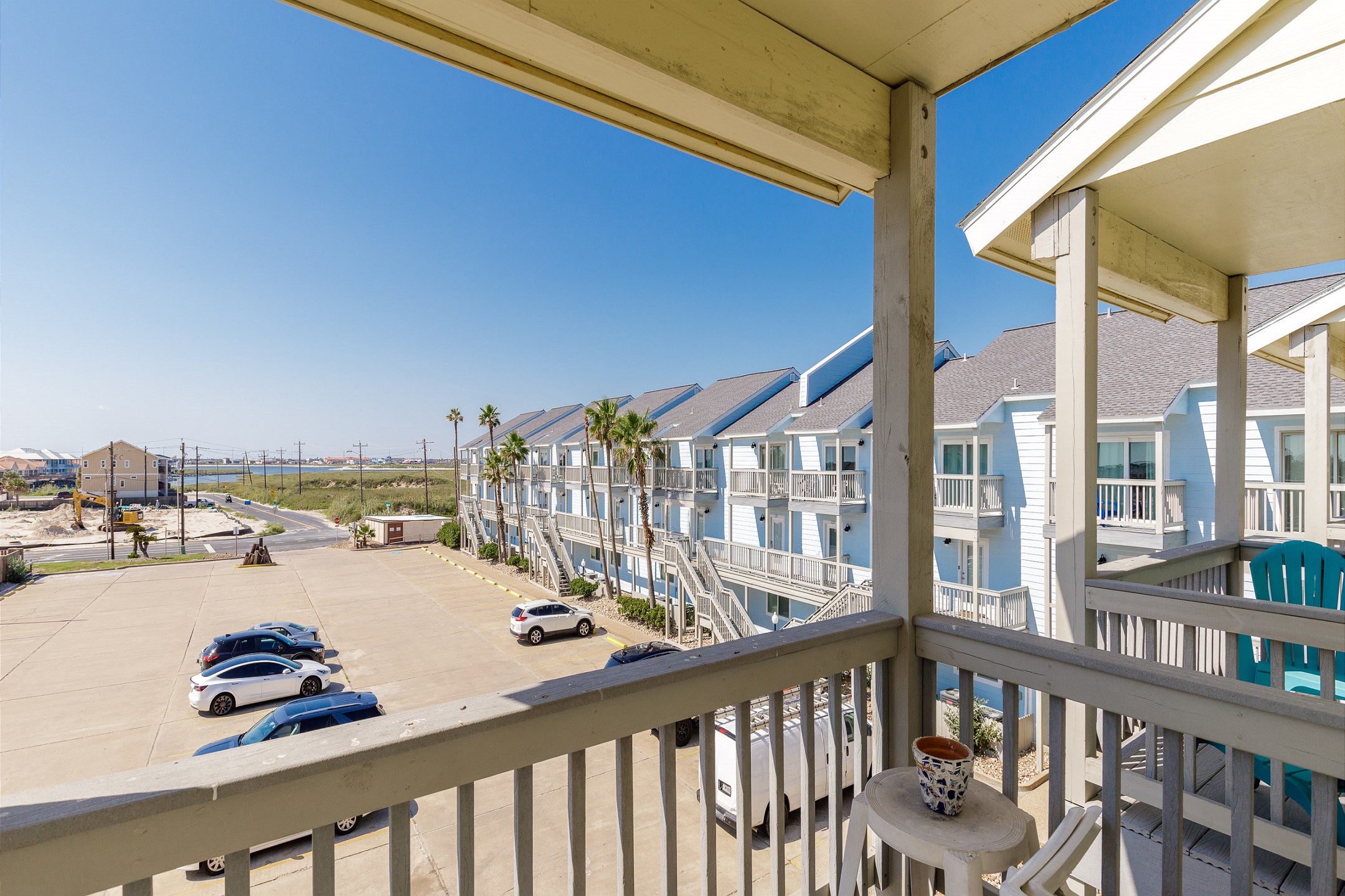 Private balcony off the guest bedroom with a parking lot view