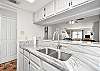 Kitchen looks into living area 