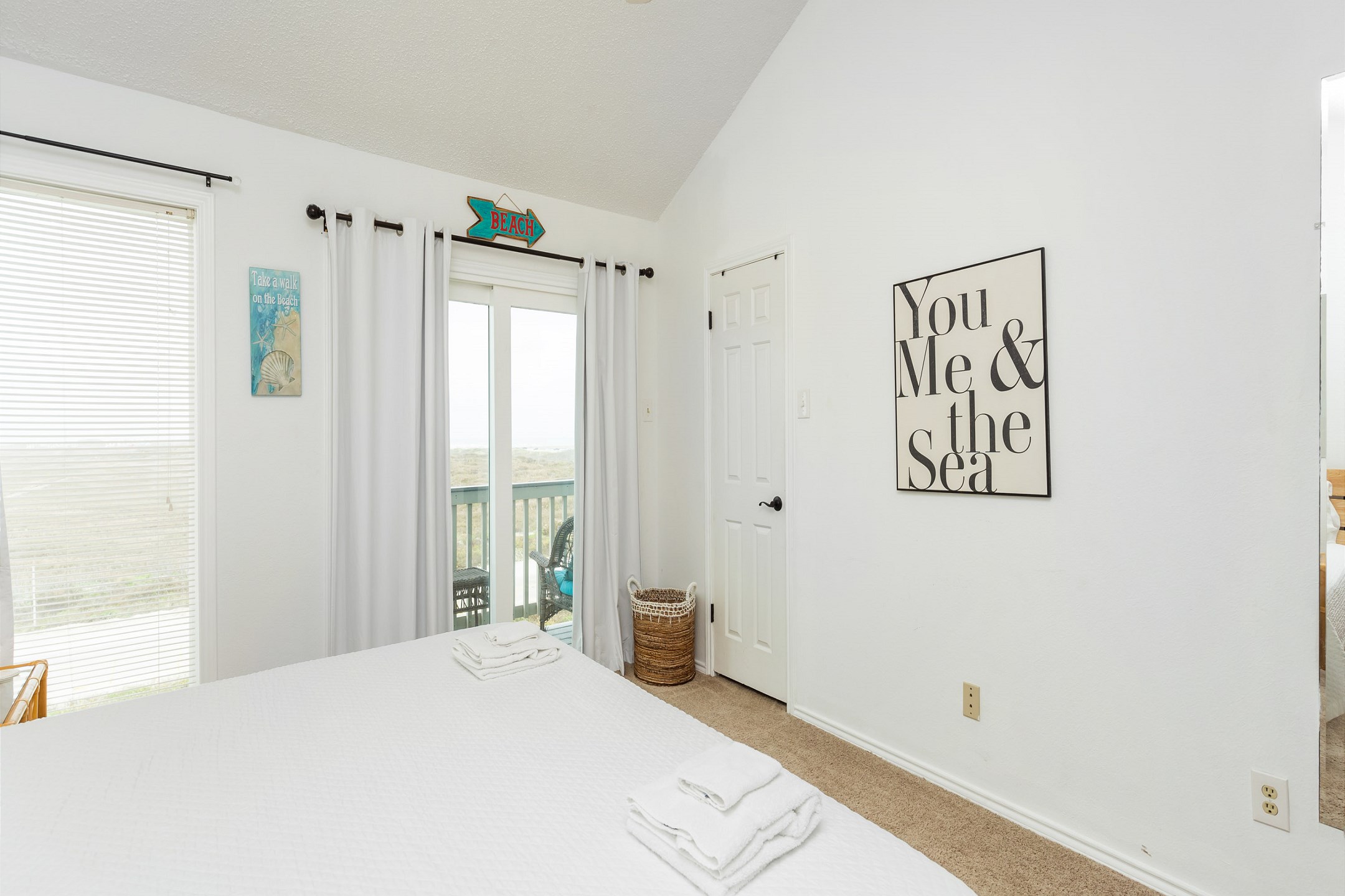 Master bedroom on the second floor with king size bed, private balcony, private bathroom and flat screen TV 