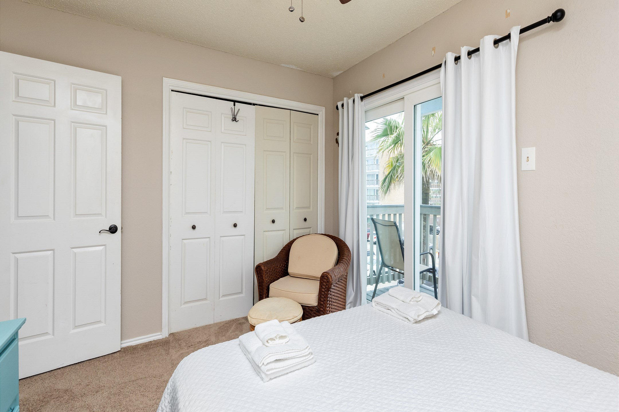 Second bedroom on the second floor with queen size bed, private balcony and flat screen TV