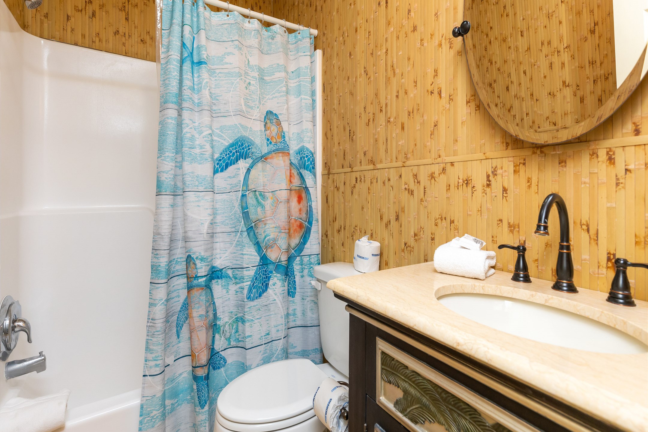 Guest bathroom with tub and shower