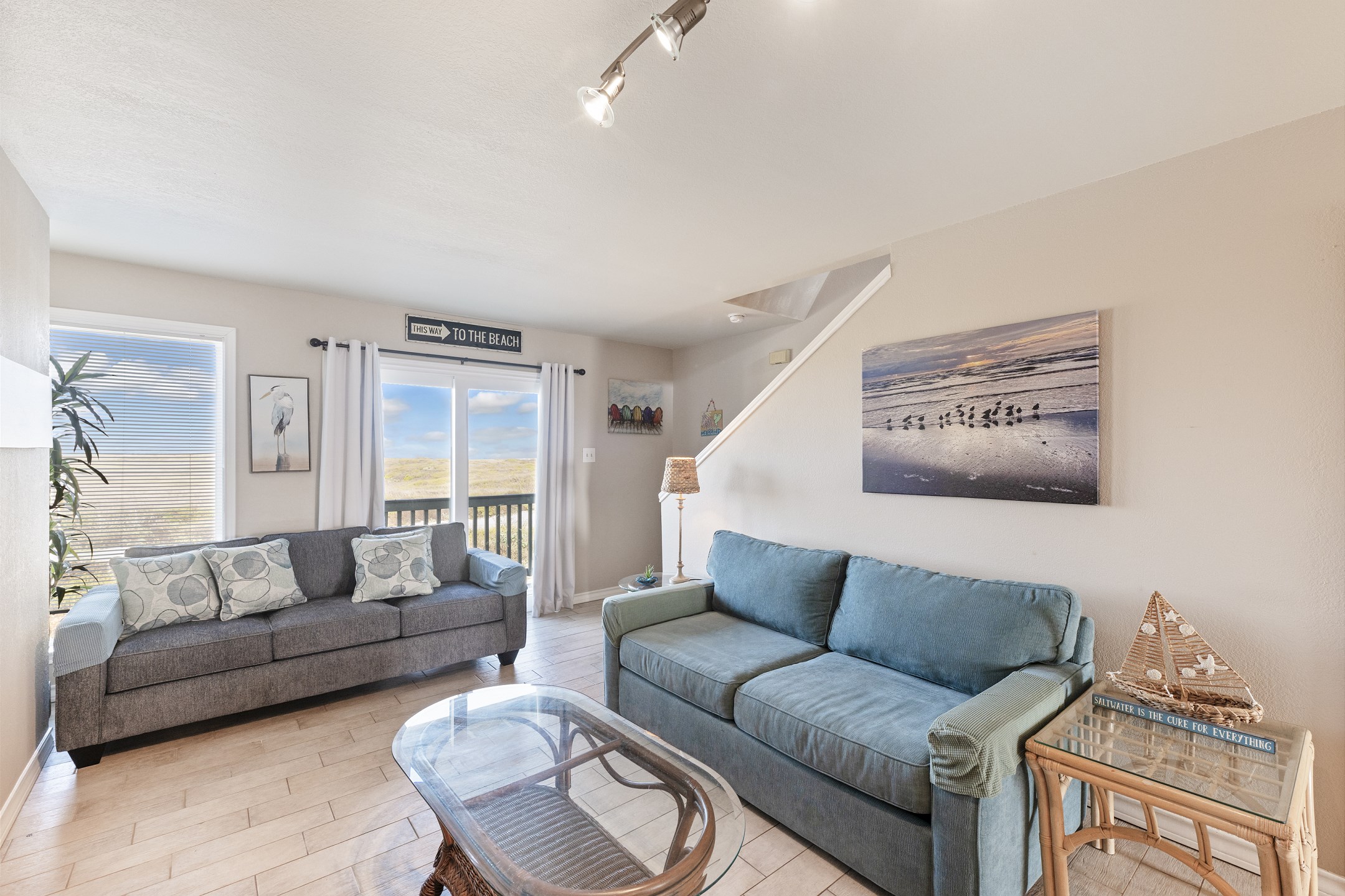 Family-friendly space with comfortable seating and direct access to outdoor balcony 