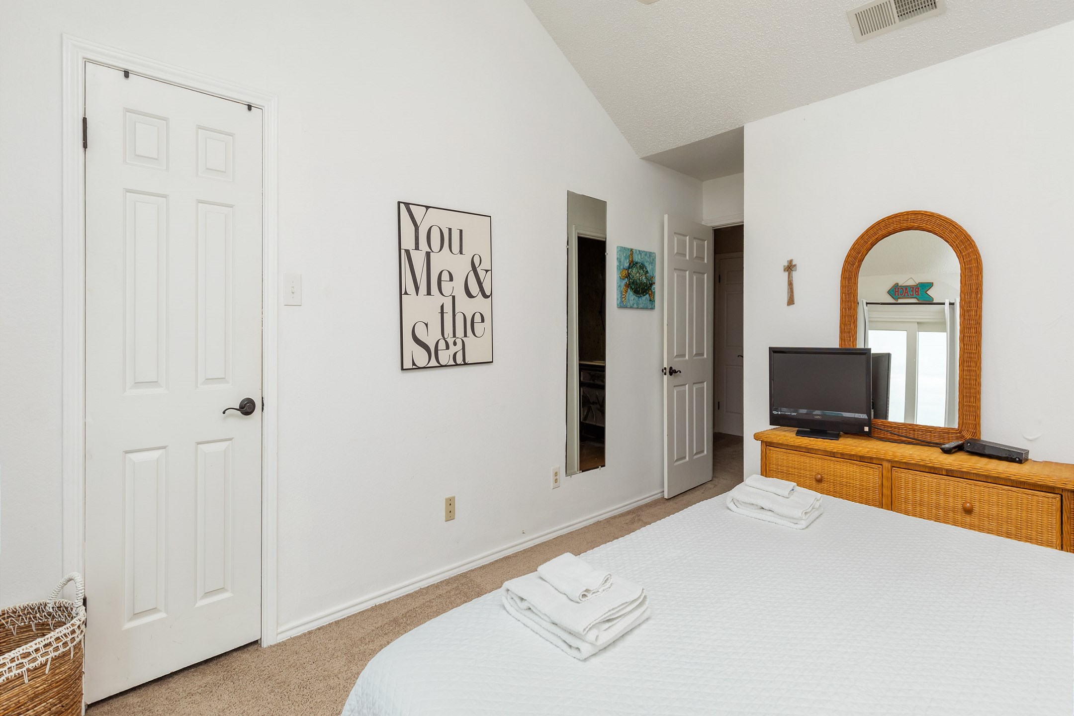 Master bedroom on the second floor with king size bed, private balcony, private bathroom and flat screen TV 