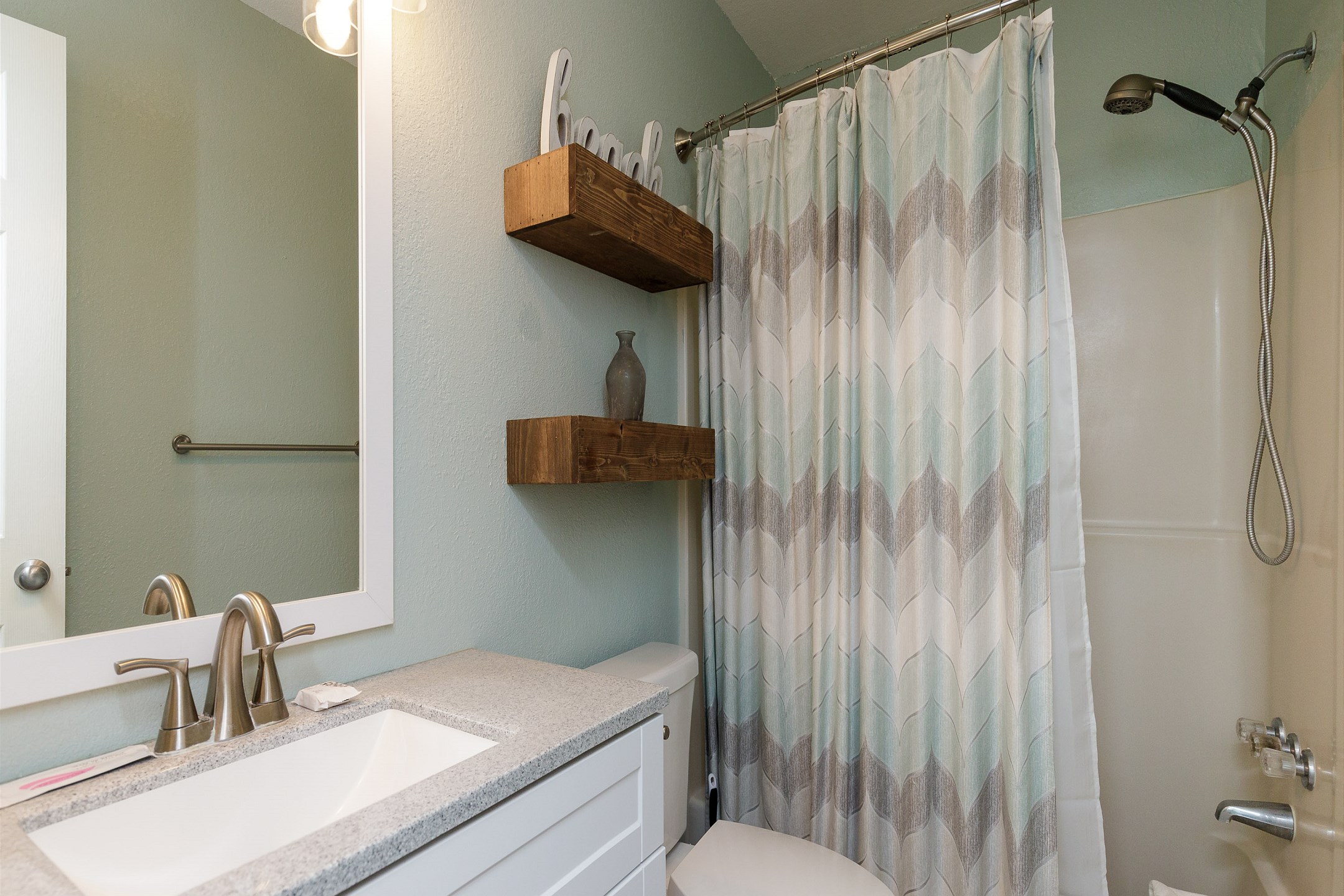 Guest bathroom with tub and shower 