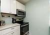 Fully equipped kitchen area with 12-cup coffee maker 