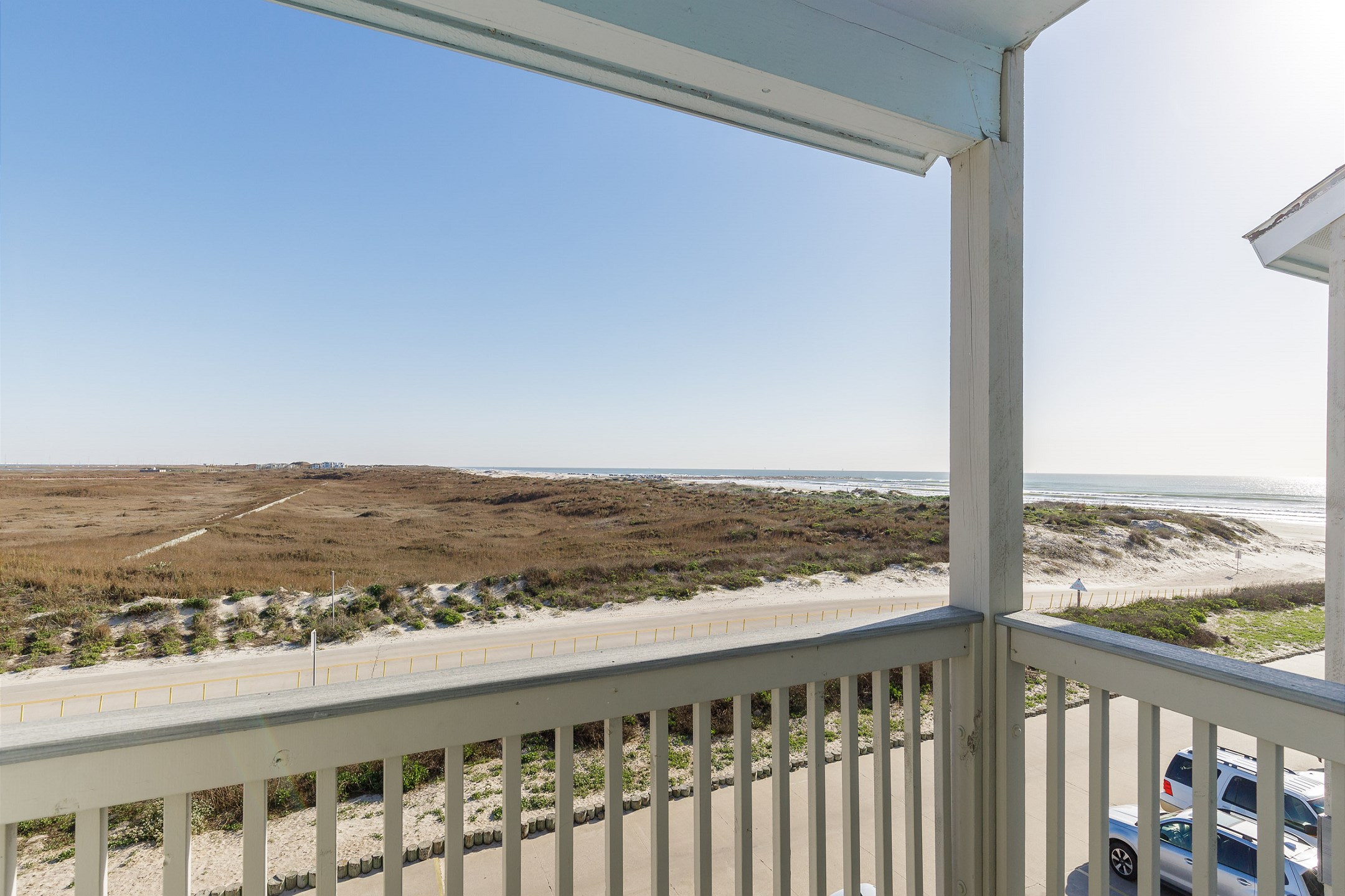 Private balcony off master bedroom with partial beach view