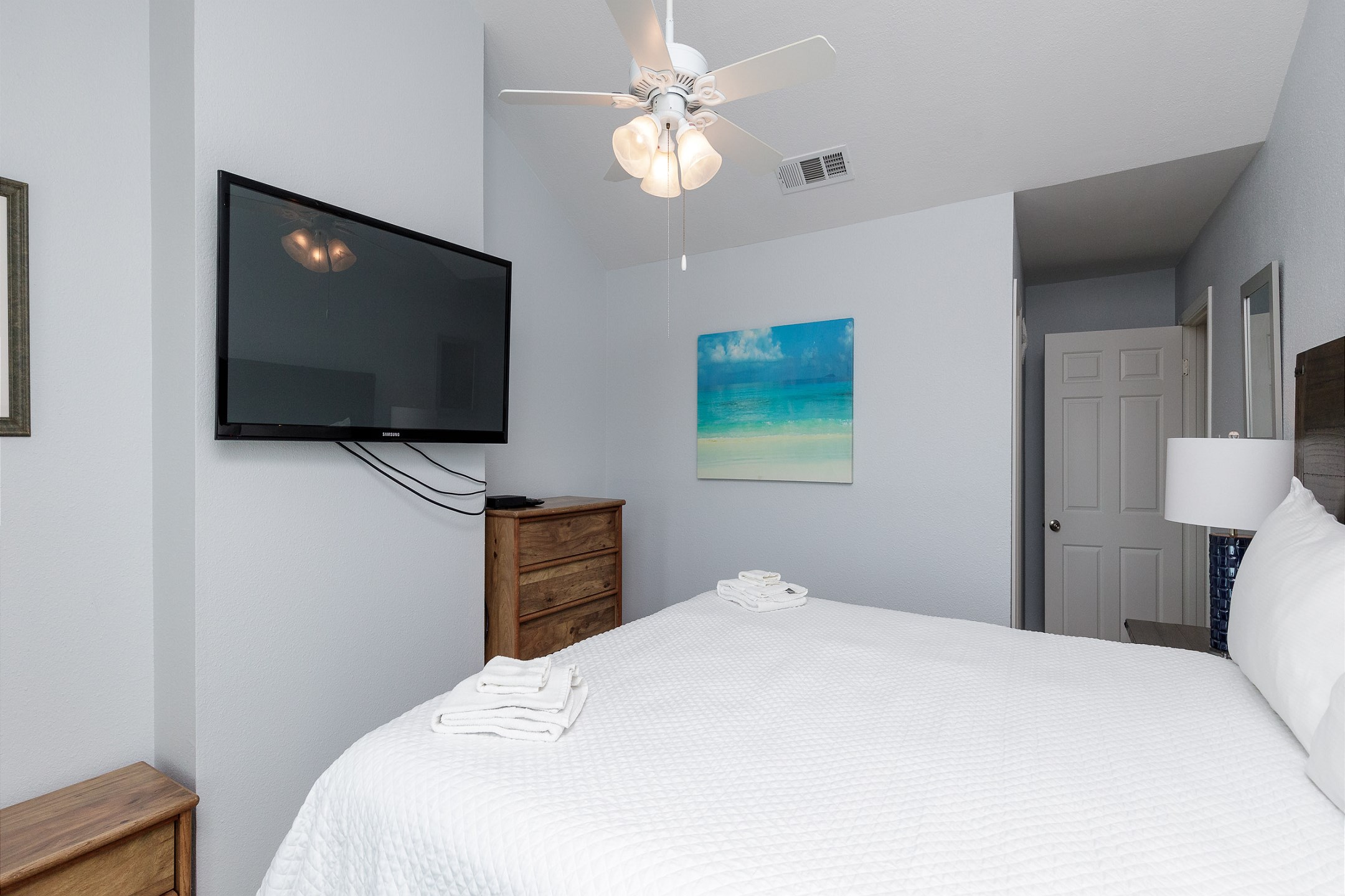 Master bedroom on second floor with king size bed, ensuite bathroom, private balcony and flat screen TV 