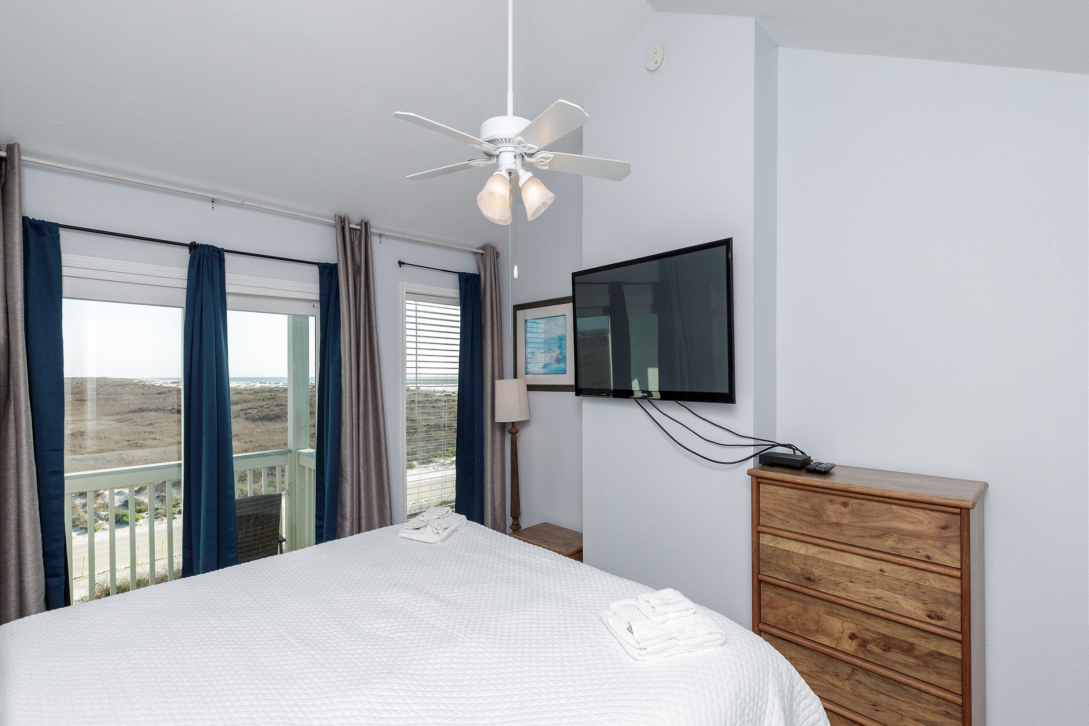 Master bedroom on second floor with king size bed, ensuite bathroom, private balcony and flat screen TV 