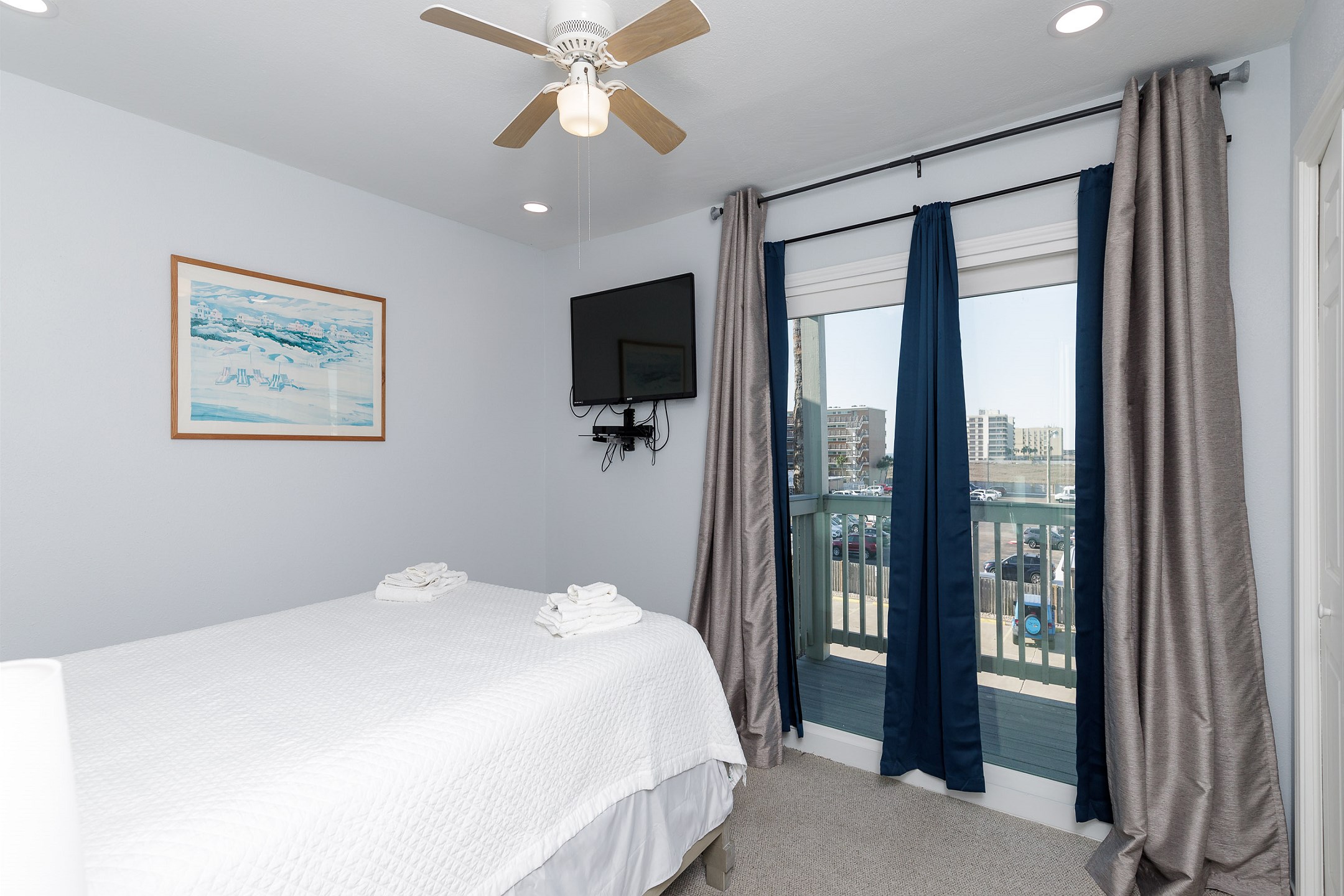 Second bedroom on the second floor with queen size bed, private balcony and flat screen TV