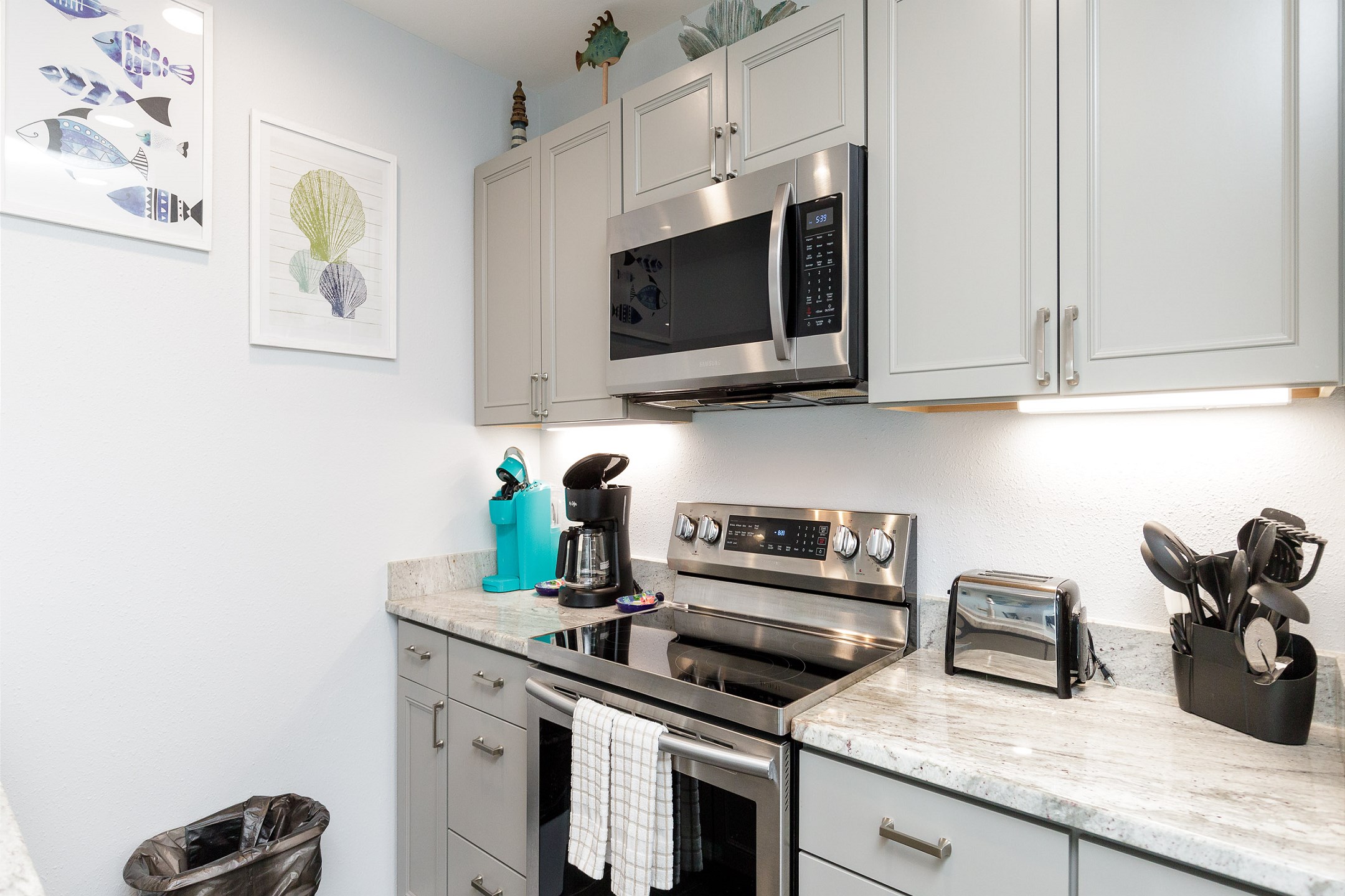 Fully equipped, modern kitchen with stainless steel appliances and beautiful counter tops