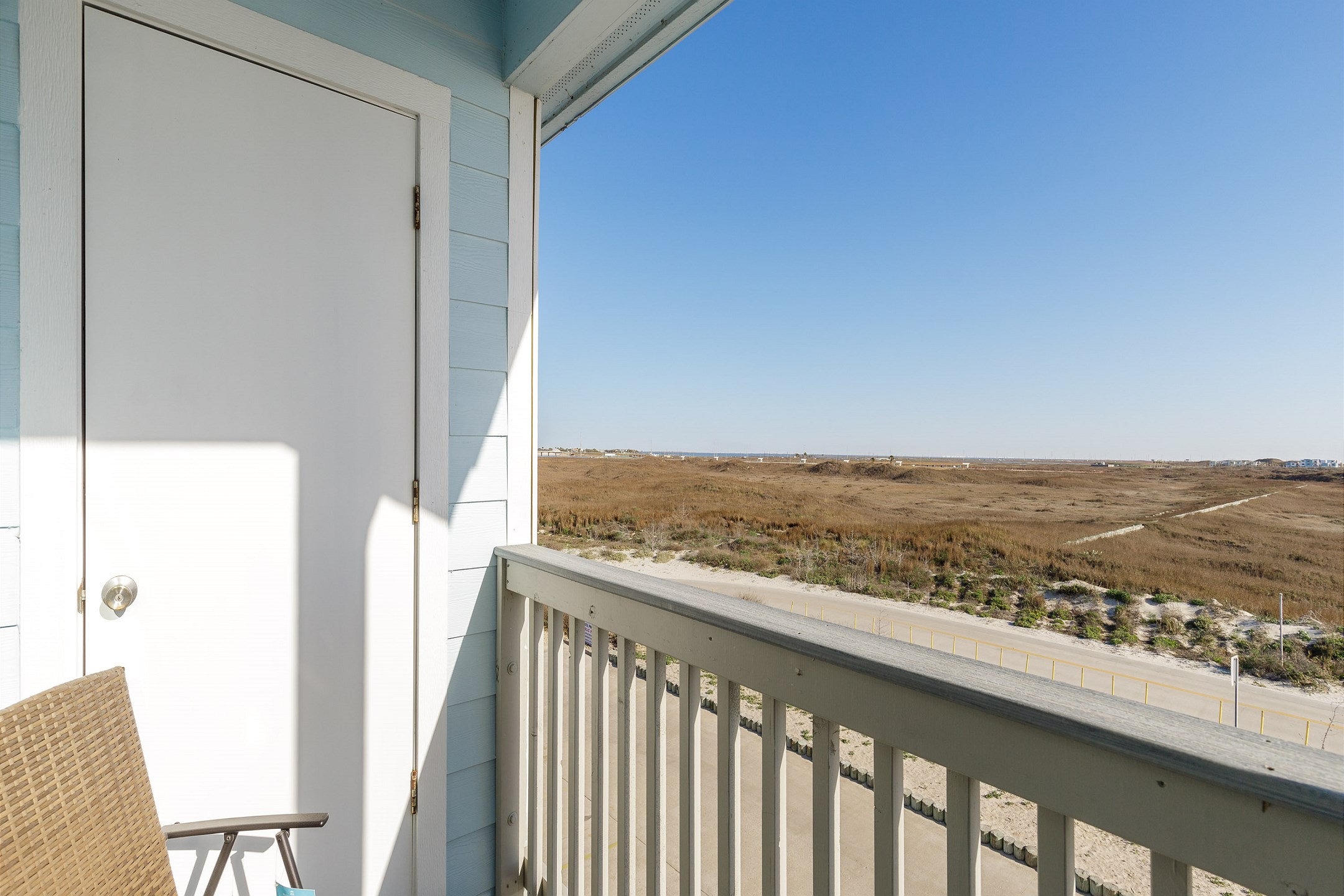 Relax and enjoy the Texas breeze on the private balcony 
