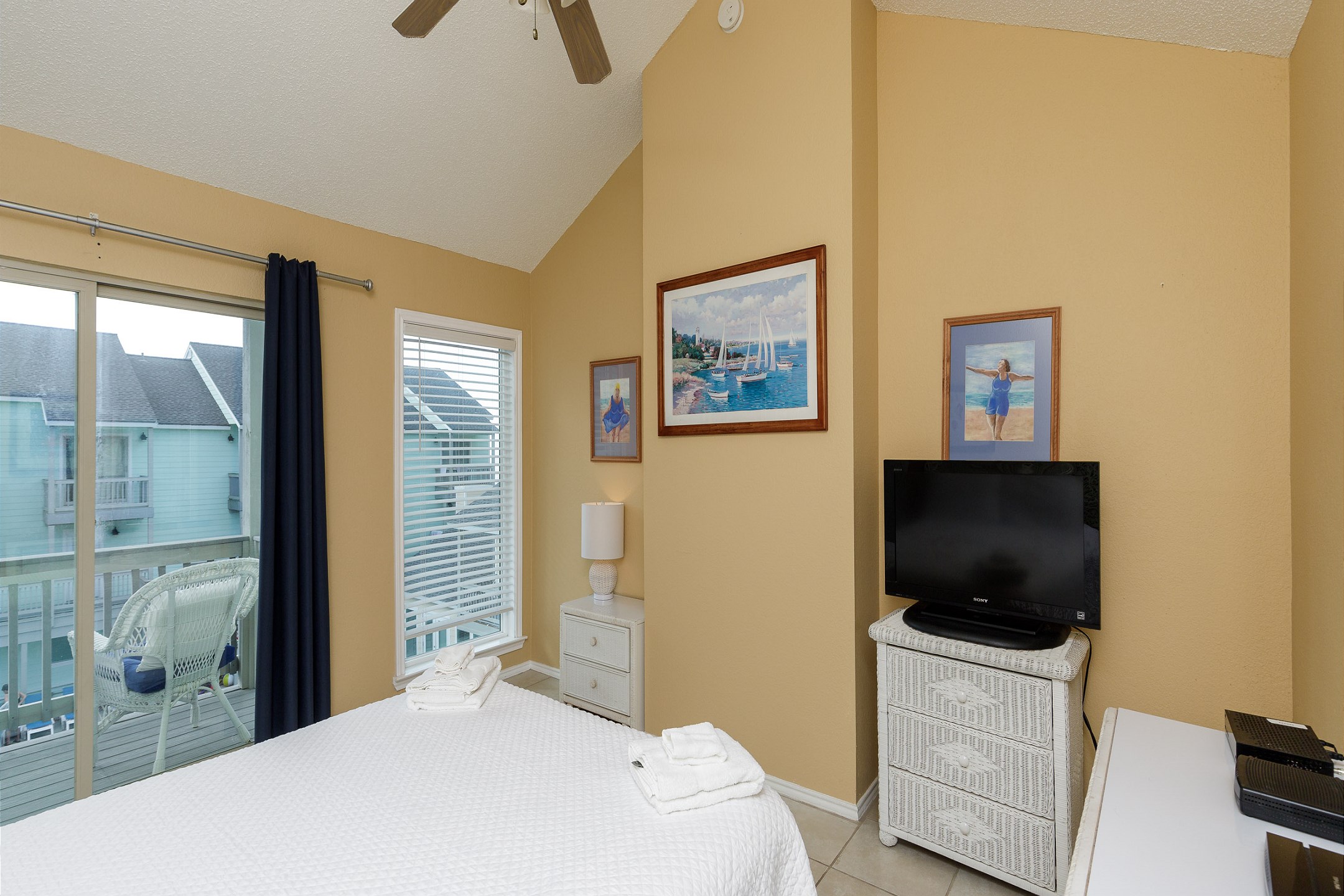 Master bedroom on the second floor with queen size bed, private bathroom, balcony and flat screen TV