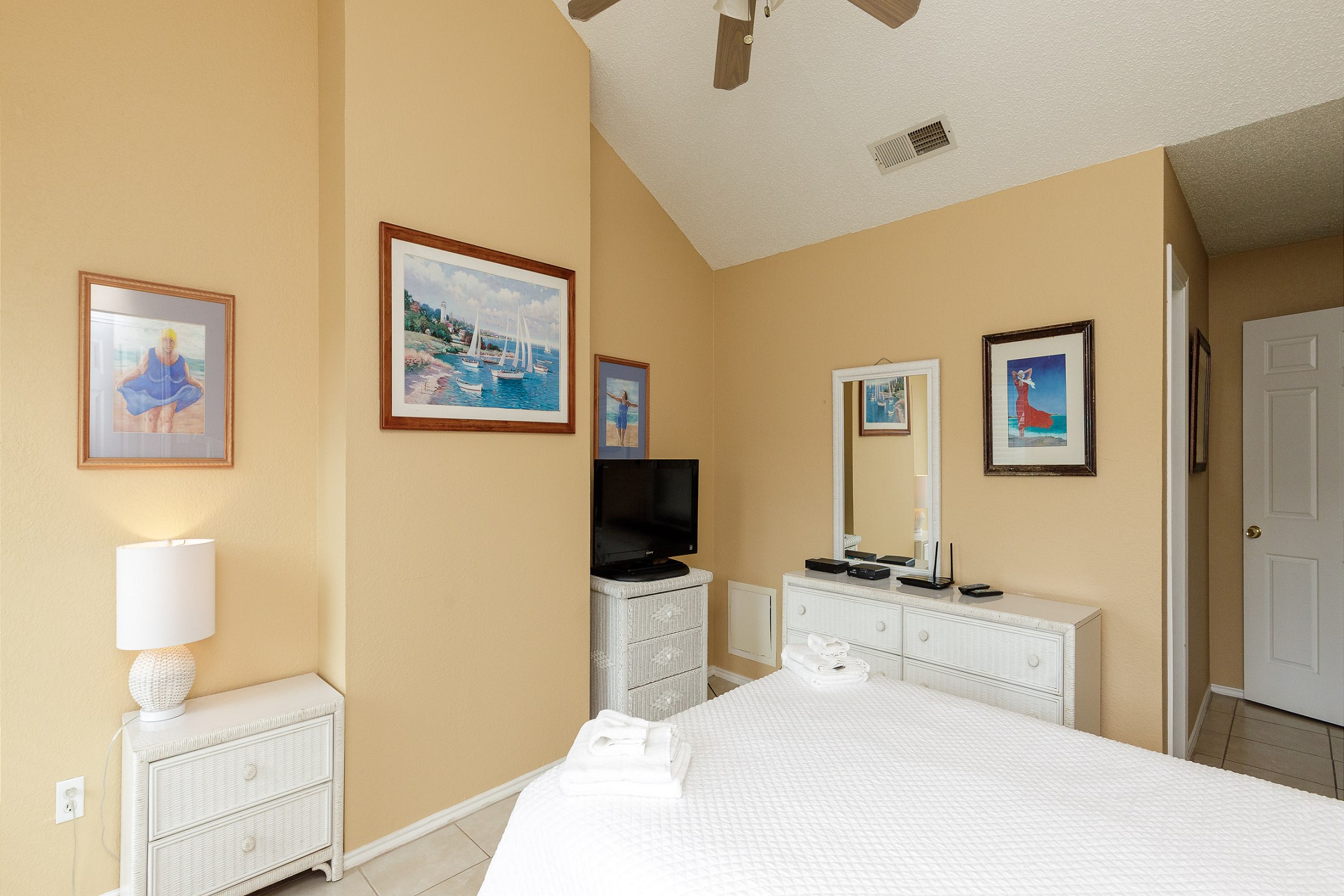 Master bedroom on the second floor with queen size bed, private bathroom, balcony and flat screen TV